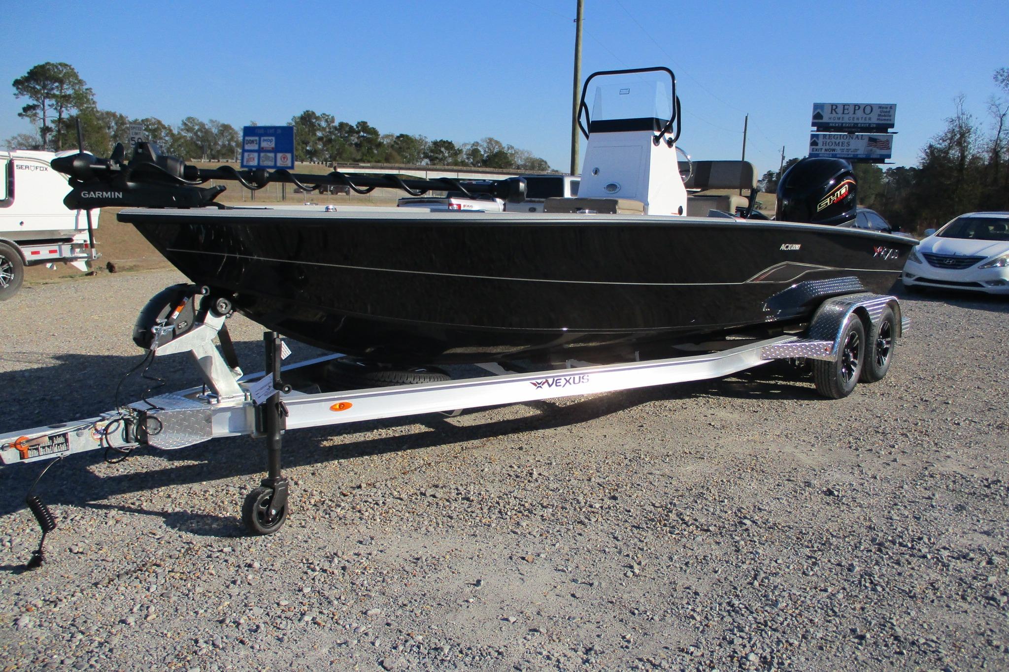 2026 Vexus ACX2210 boat on trailer, black exterior, parked outdoors.