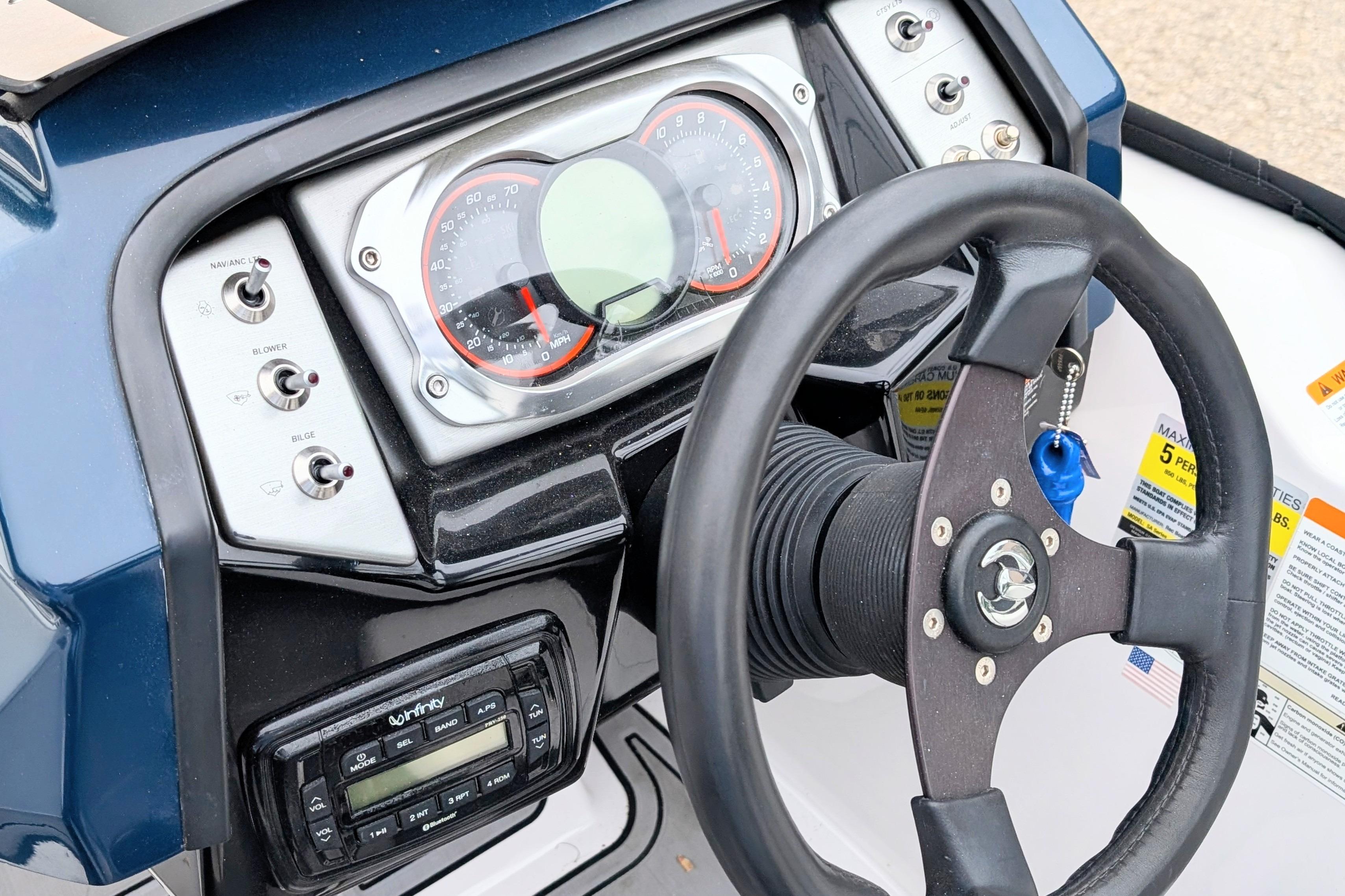 2016 Scarab 165 ID dashboard with steering wheel and control panel.