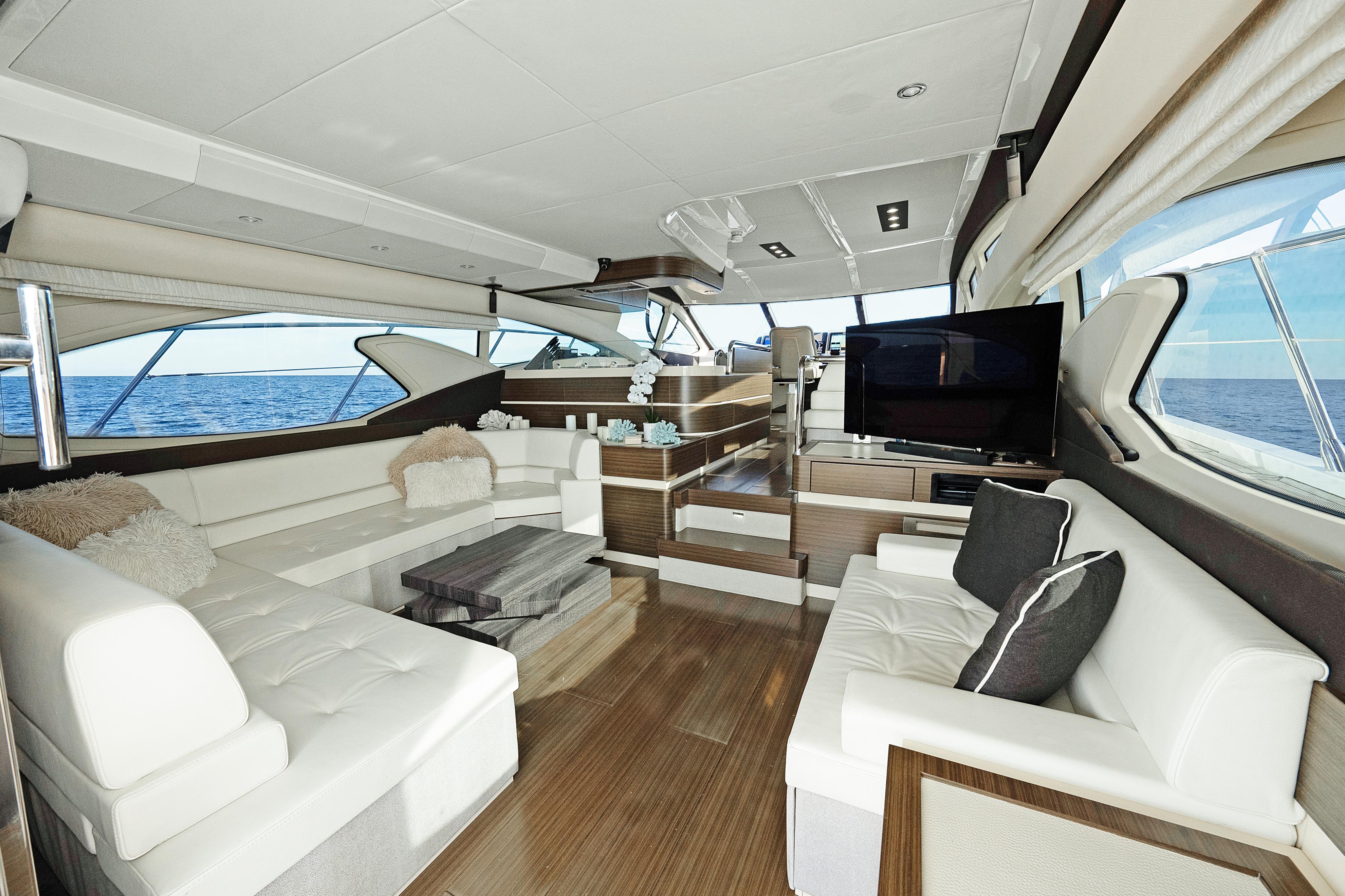 Luxurious interior of 2017 Azimut 60 Flybridge yacht with elegant seating and ocean view.
