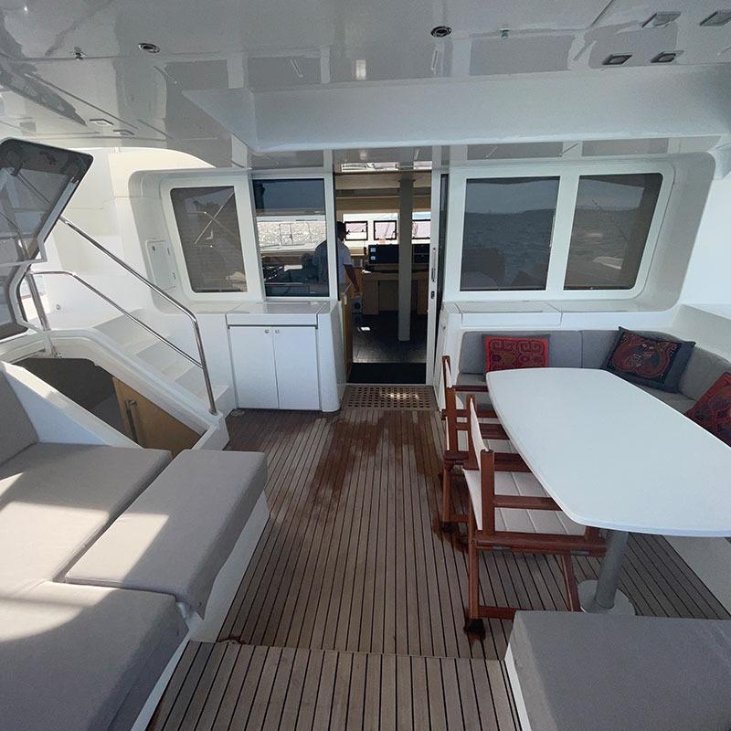 Spacious 2016 Lagoon 52 yacht interior with seating and dining area.