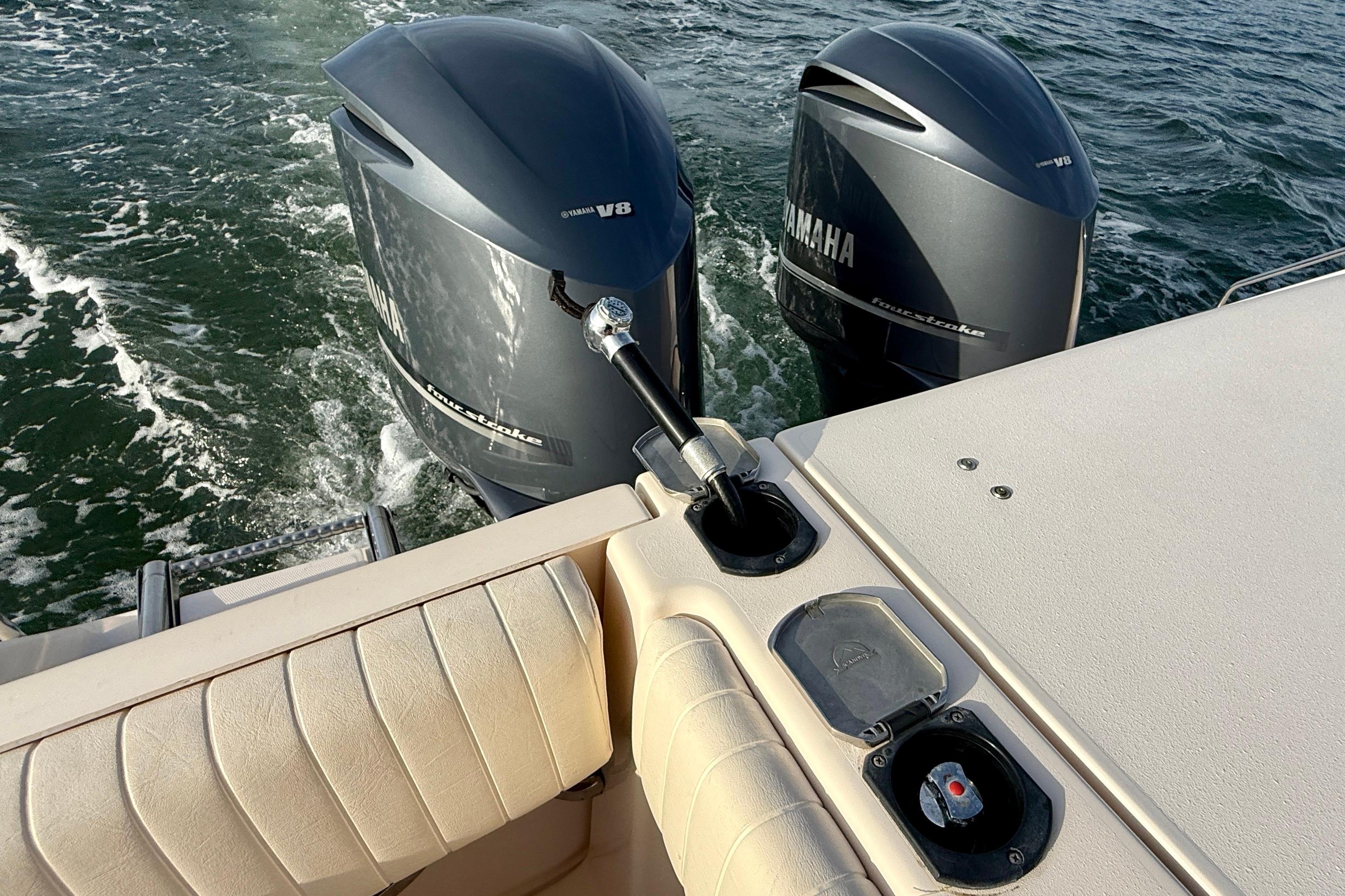 2012 Grady-White Canyon 336 boat with twin Yamaha V8 outboard engines on water.