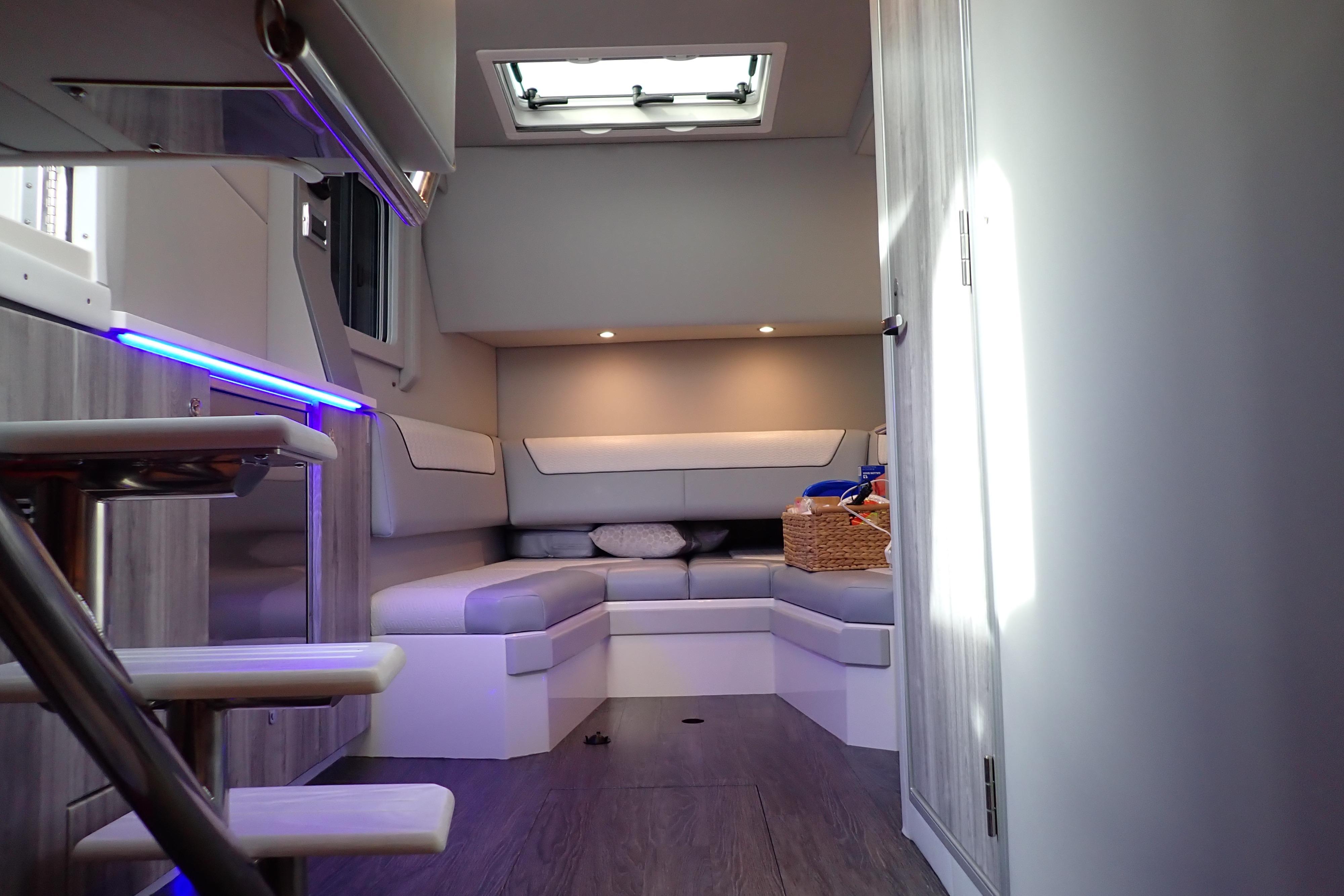 Interior of 2024 Formula 400 Super Sport Crossover, featuring modern seating and ambient lighting.