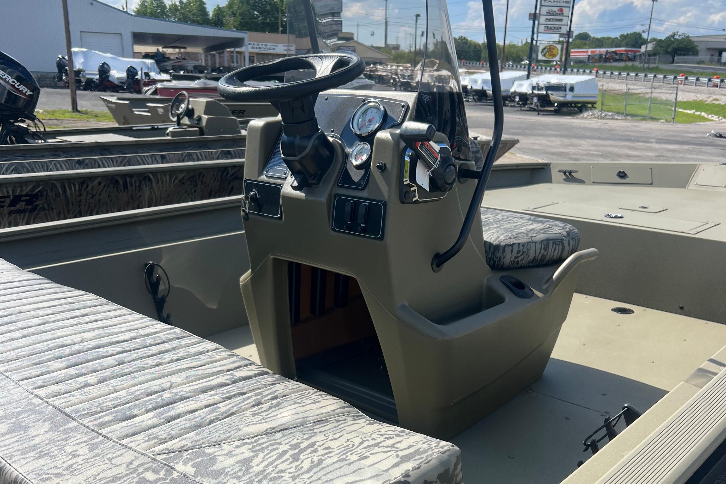 2026 Tracker Grizzly 1860 CC boat interior with steering console and seating.