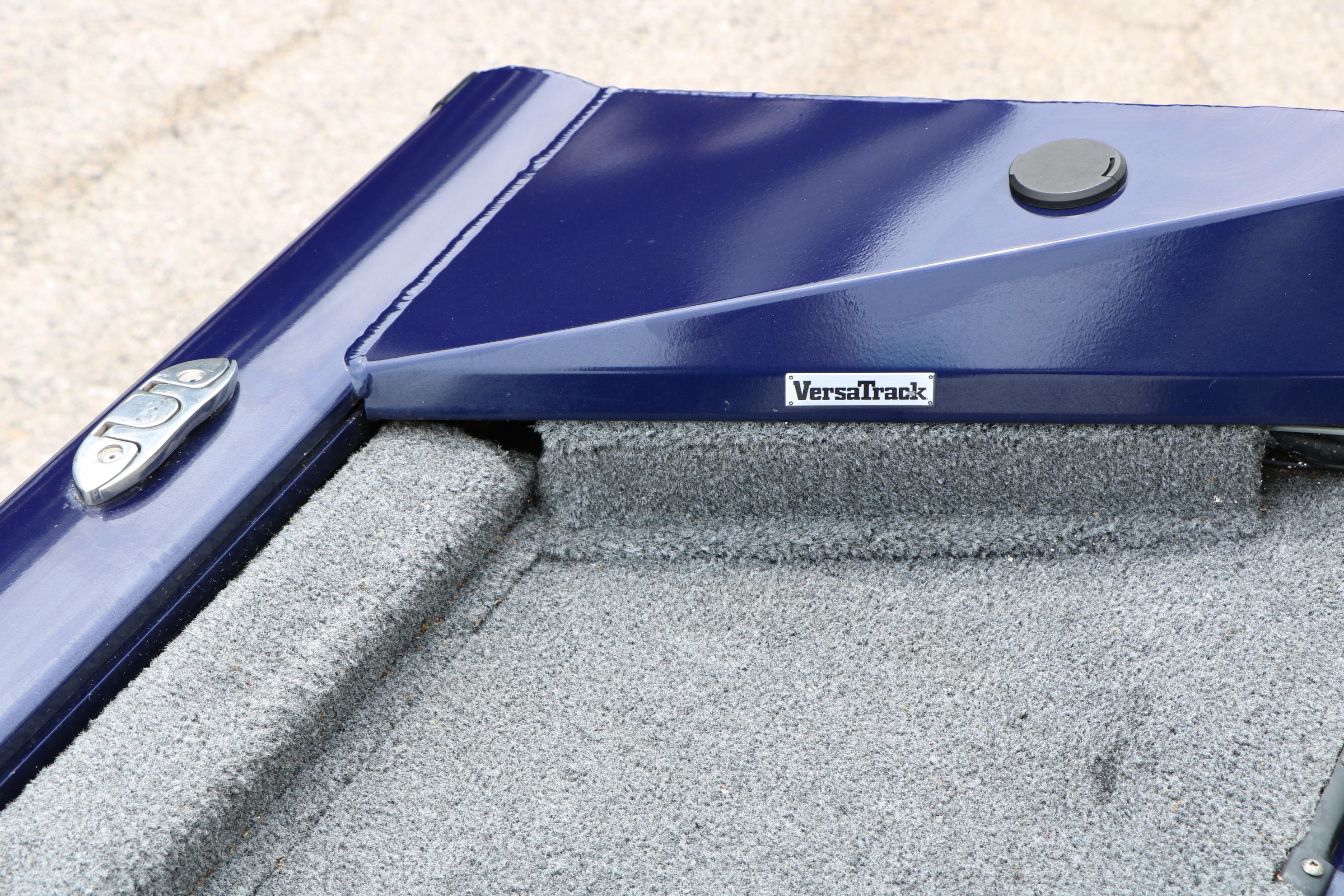 2022 Tracker Pro Team 175 TF boat with VersaTrack system, blue finish, and carpeted interior.