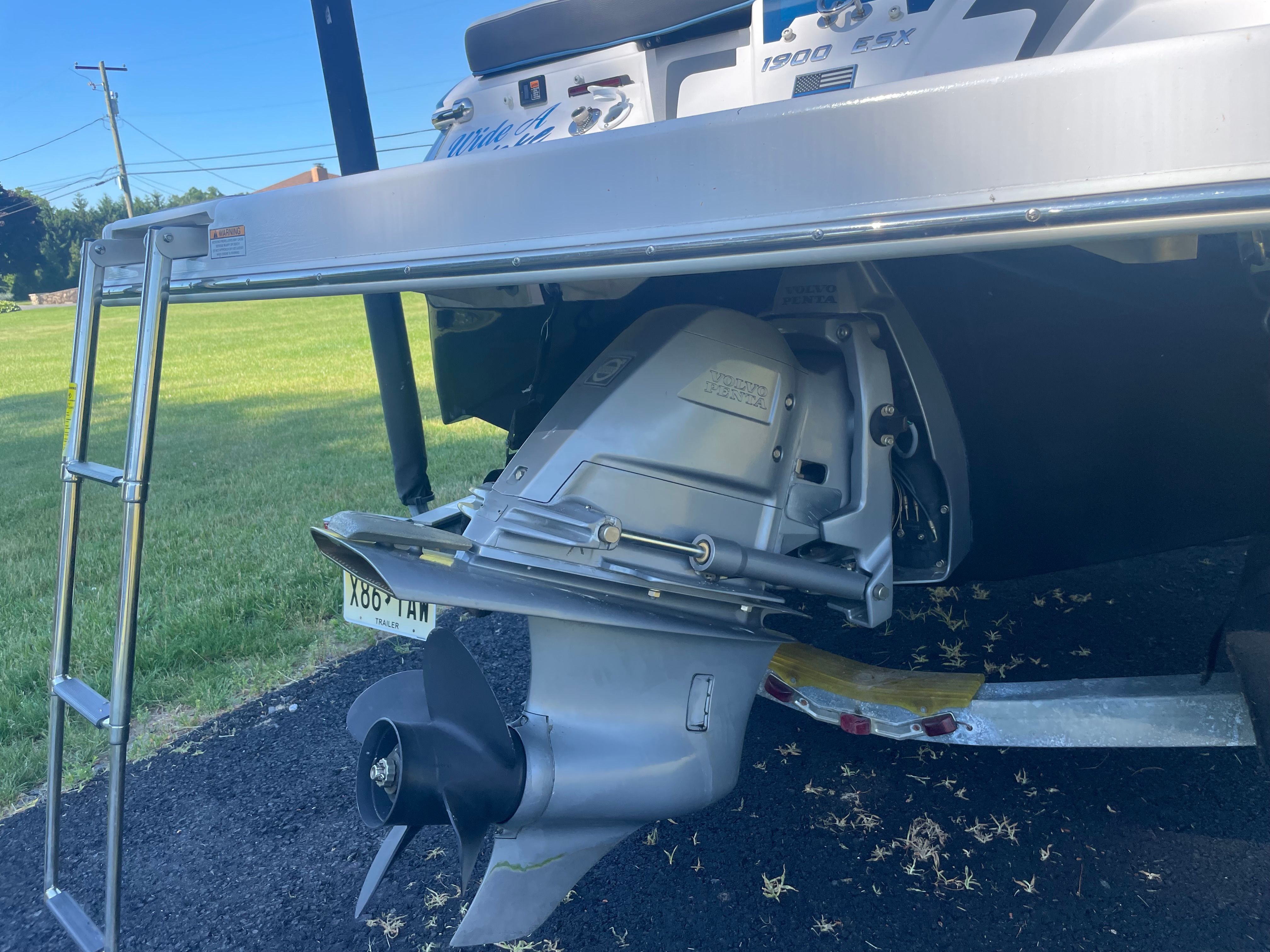 Rear view of a 2016 Regal 1900 ESX Bowrider with an outboard motor.
