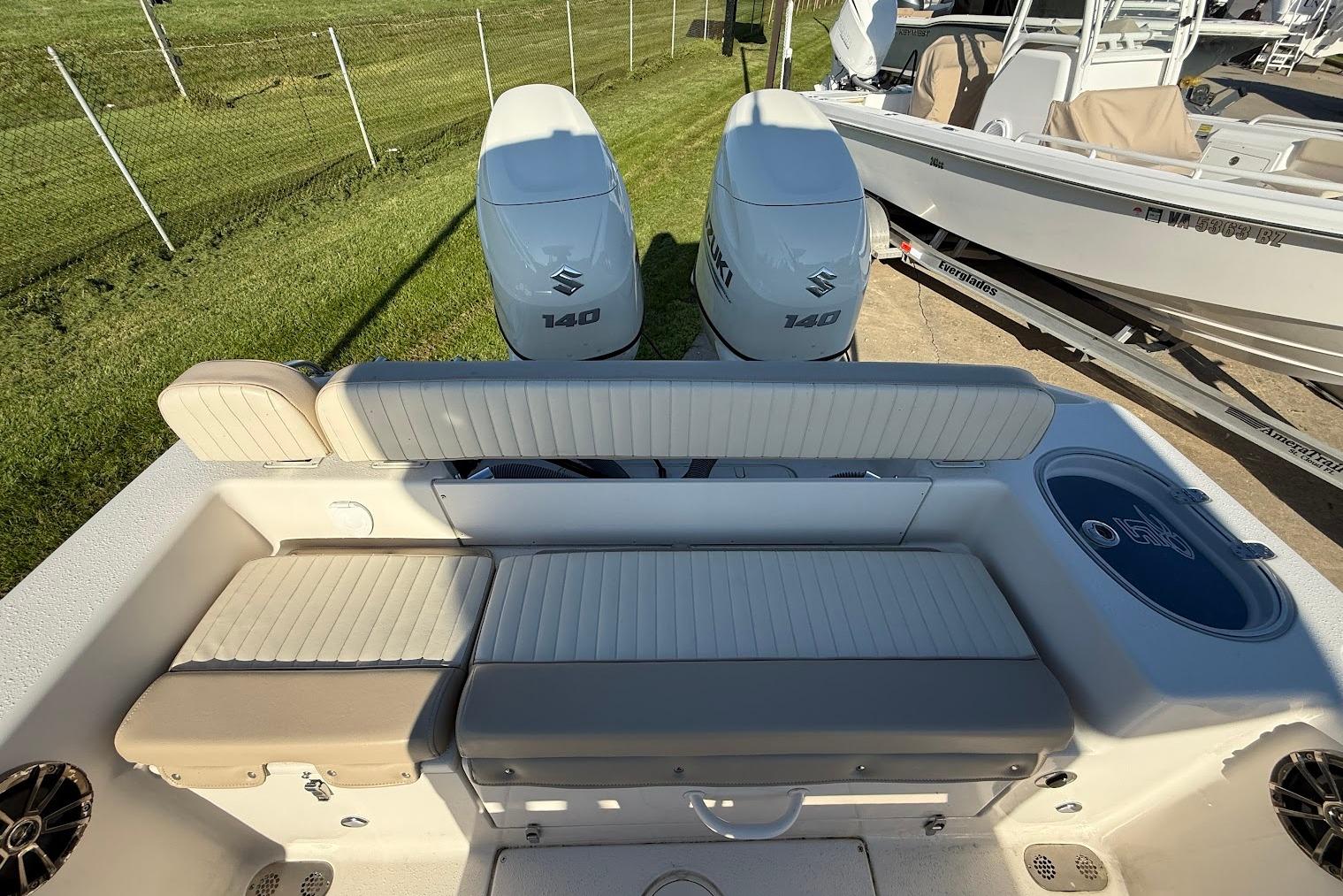 2019 Sea Chaser 24 HFC boat with dual Suzuki 140 engines and cushioned seating.