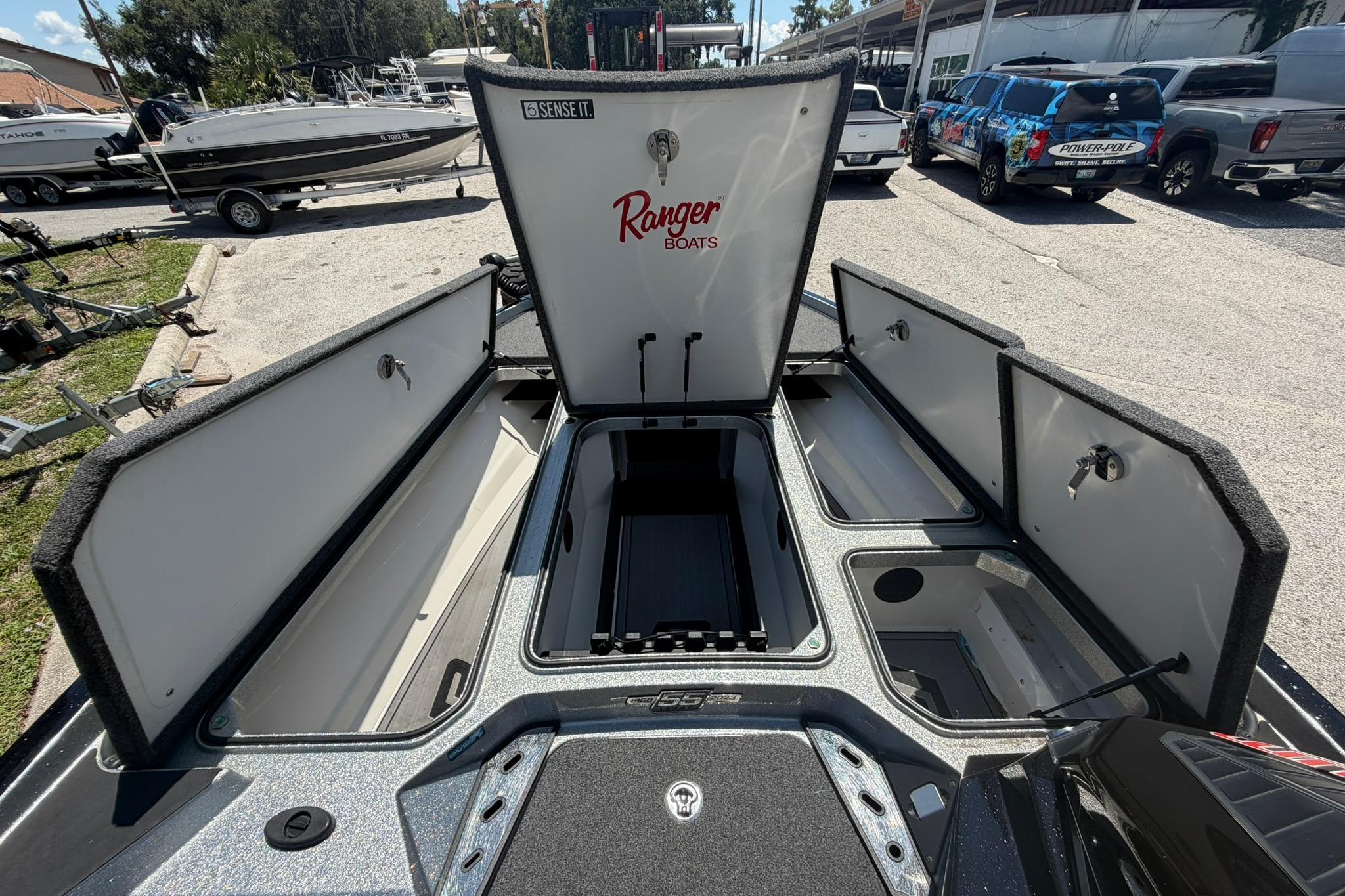 2023 Ranger Z521R boat storage compartments open, showcasing spacious interior design.