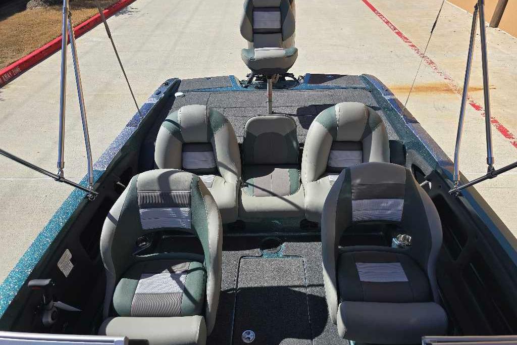 2026 Ranger 212LS boat interior with four cushioned seats and fishing rod holders.