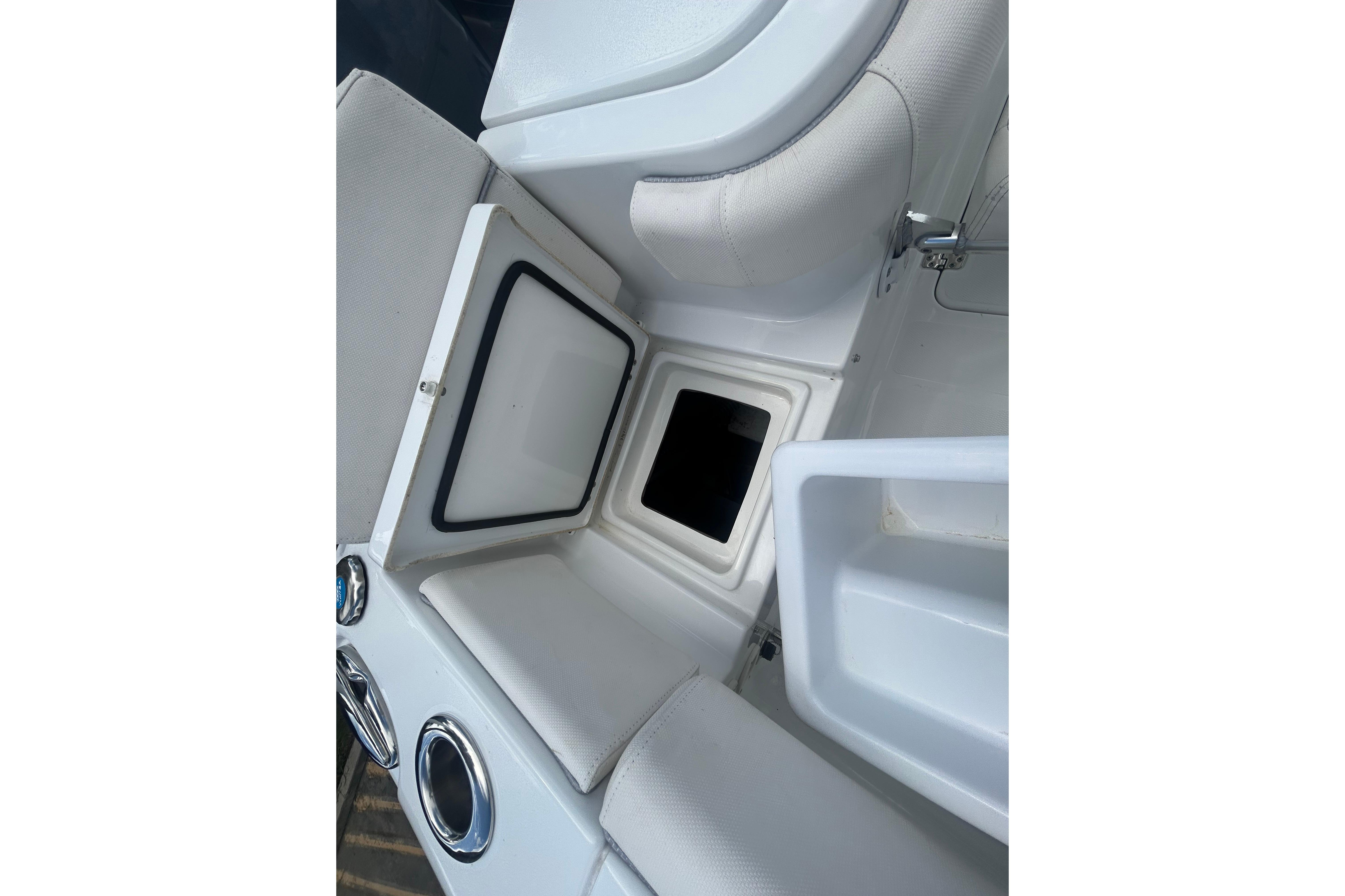 2023 Sea Hunt Gamefish 27 Coffin Box interior with open storage compartment.
