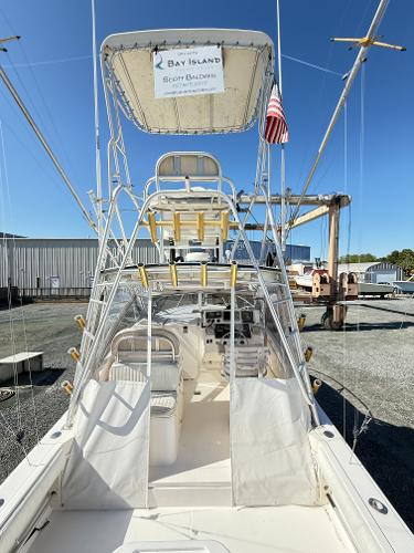 2001 Albemarle 280 Express Sport Fisherman boat with diesel power, docked under clear blue sky.