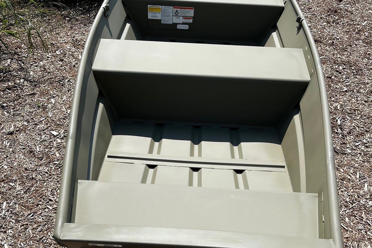 2026 Tracker Grizzly 12 Jon boat, interior view, showcasing seating and storage layout.