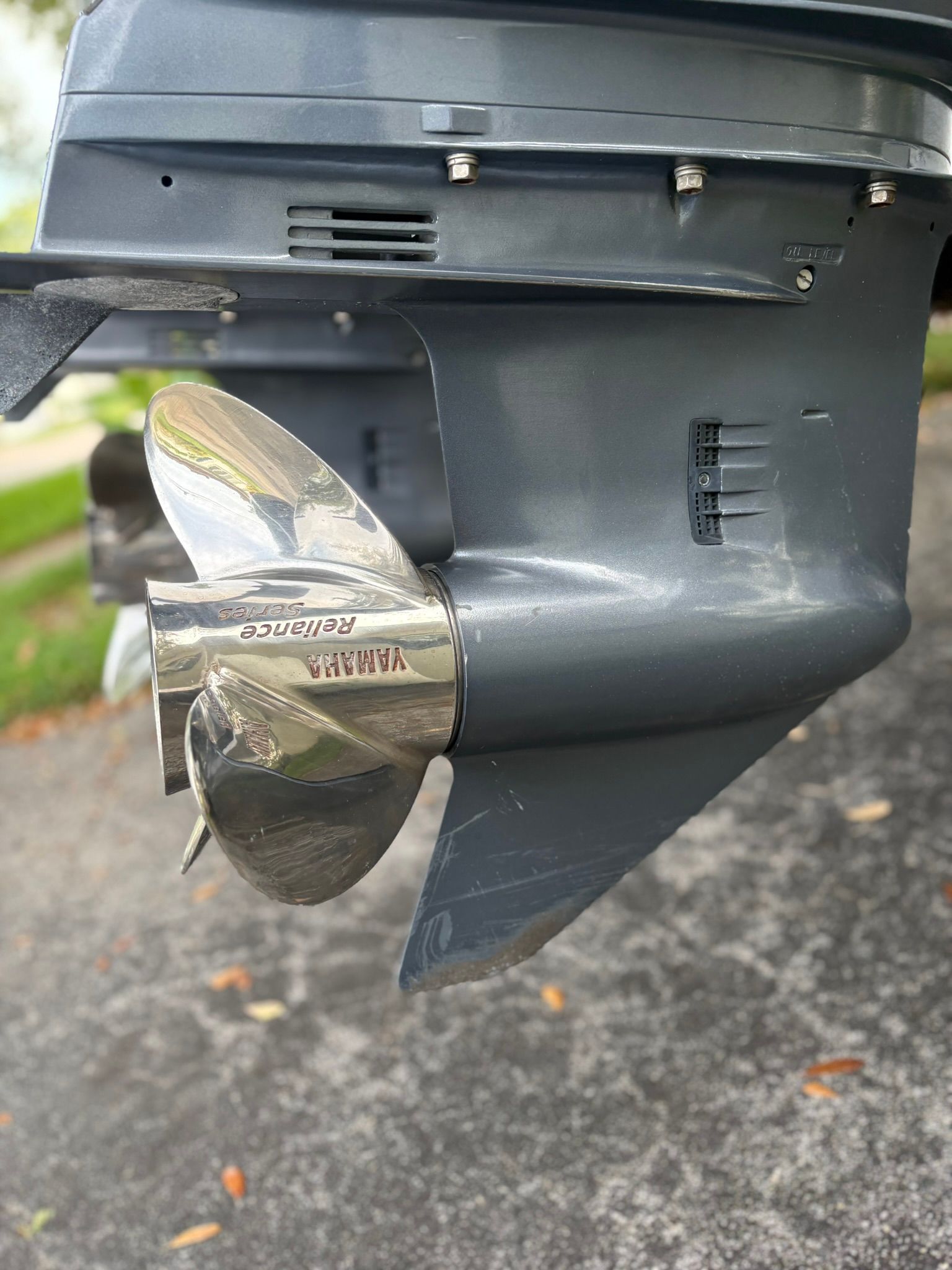 Close-up of a Yamaha outboard motor with propeller on a boat.