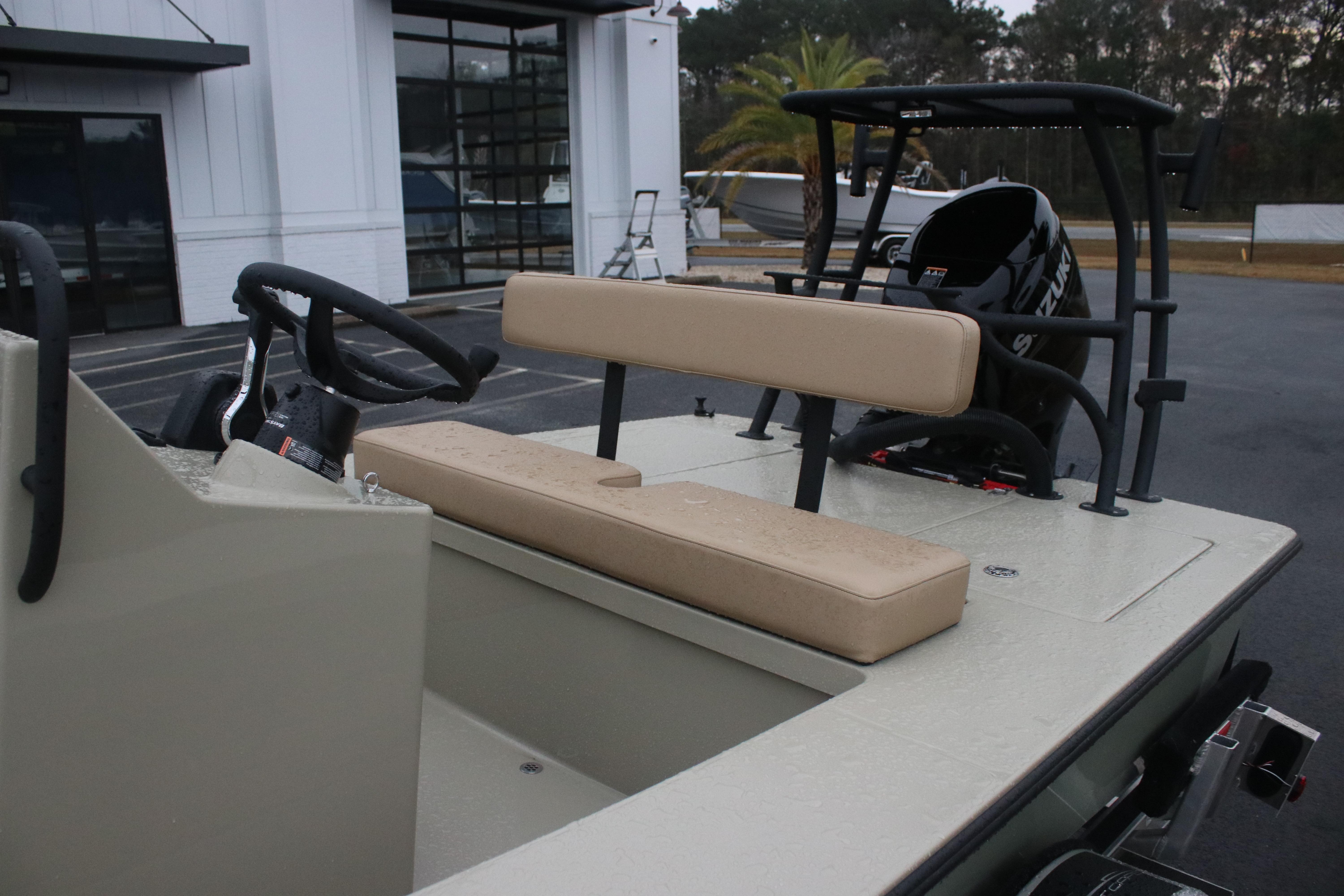 2026 East Cape EVO 18V boat interior with beige seating and steering console.