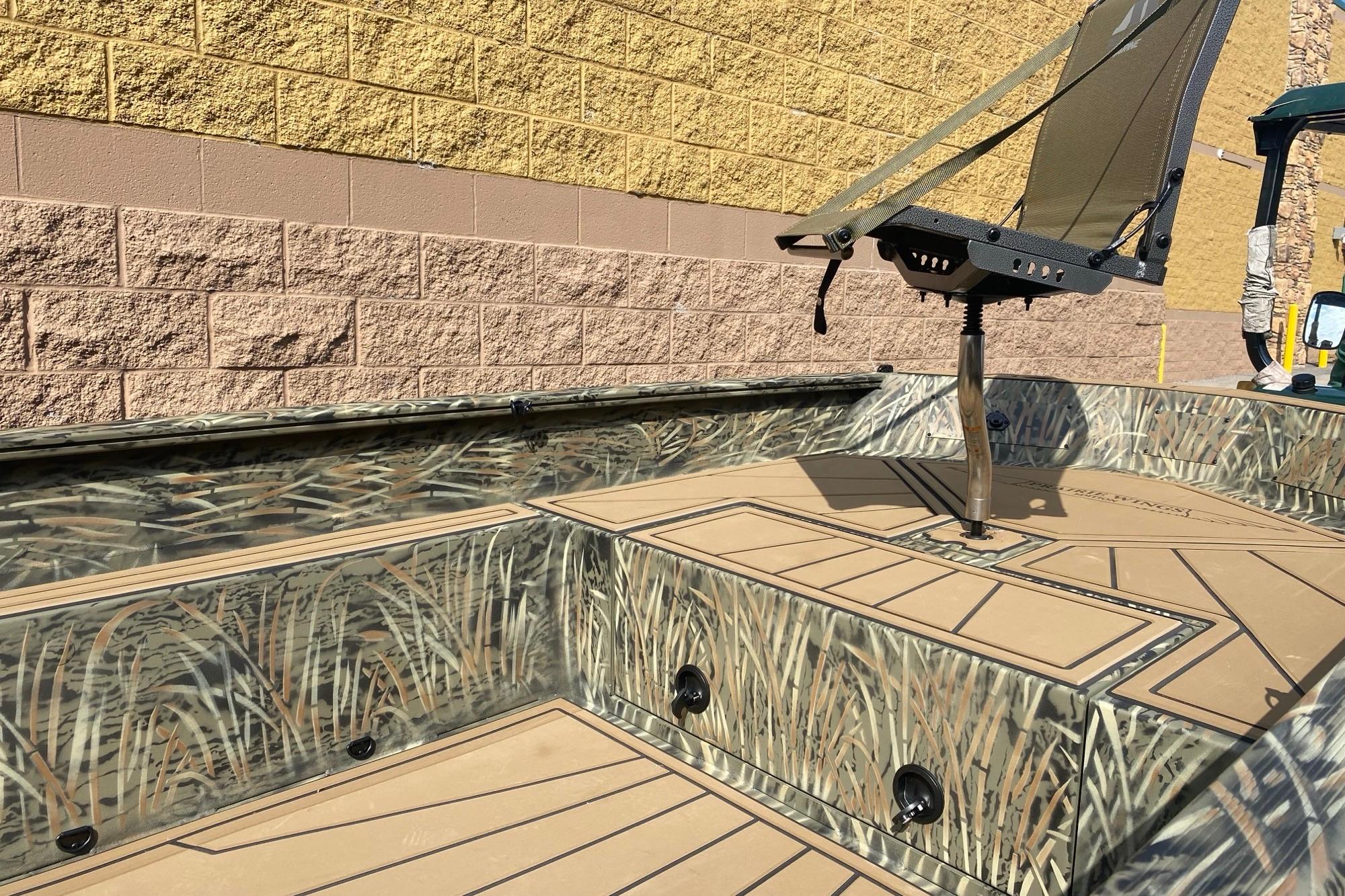 2026 Tracker Grizzly 1650 T Prairie Wings Edition boat with camouflage design.