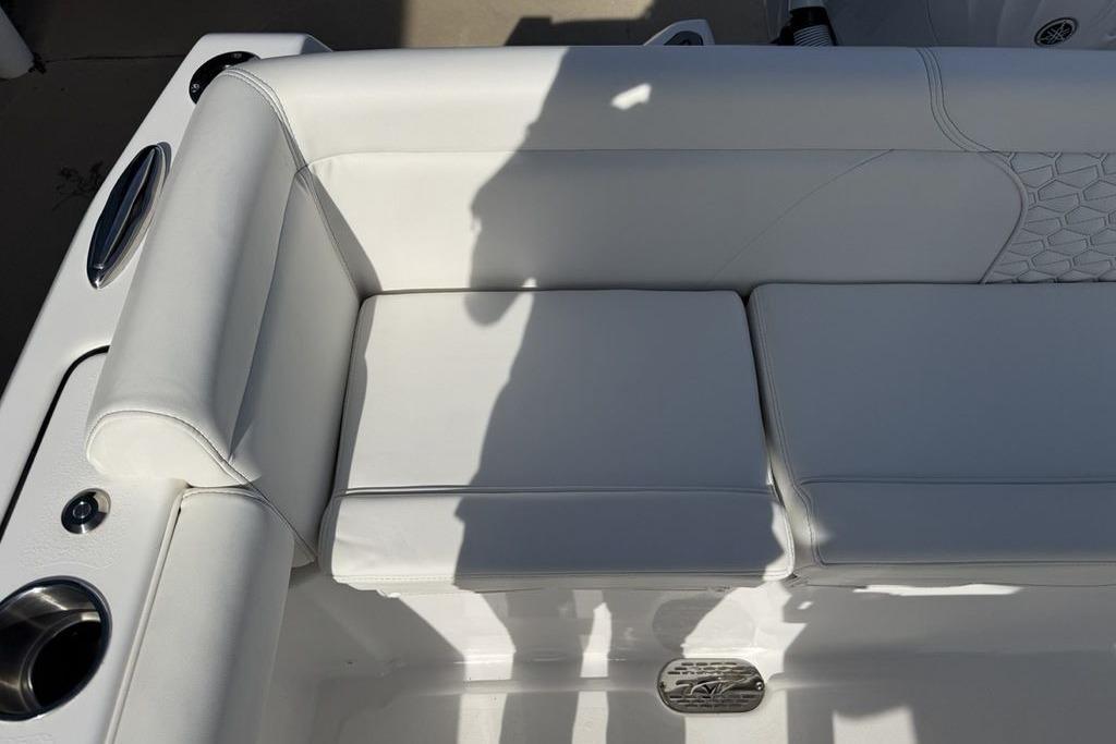 White seating on 2026 Tidewater 232 LXF boat, featuring sleek design and cup holder.