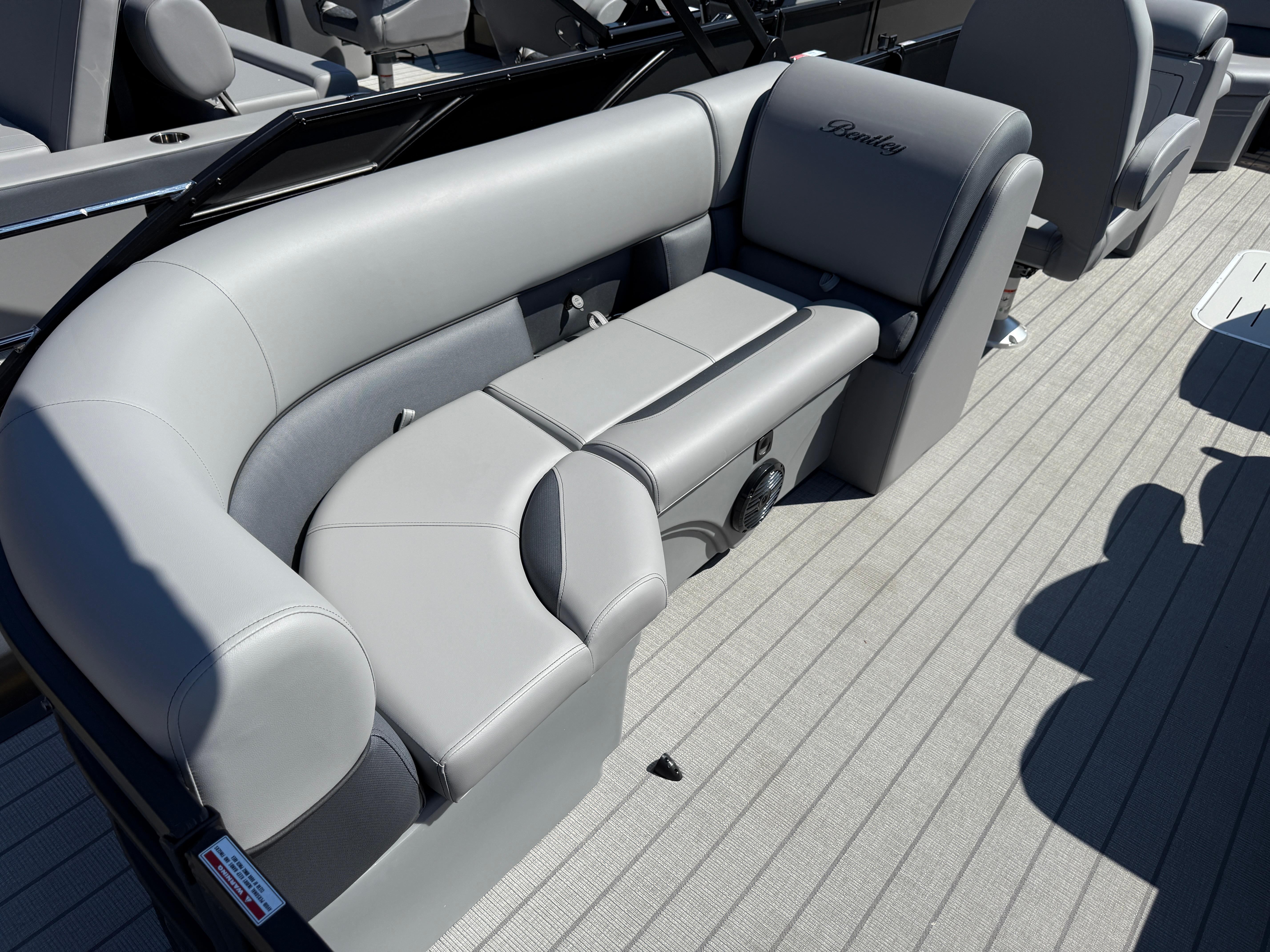 Luxurious seating on 2026 Bentley Pontoons Legacy 223 Navigator, featuring elegant gray upholstery.