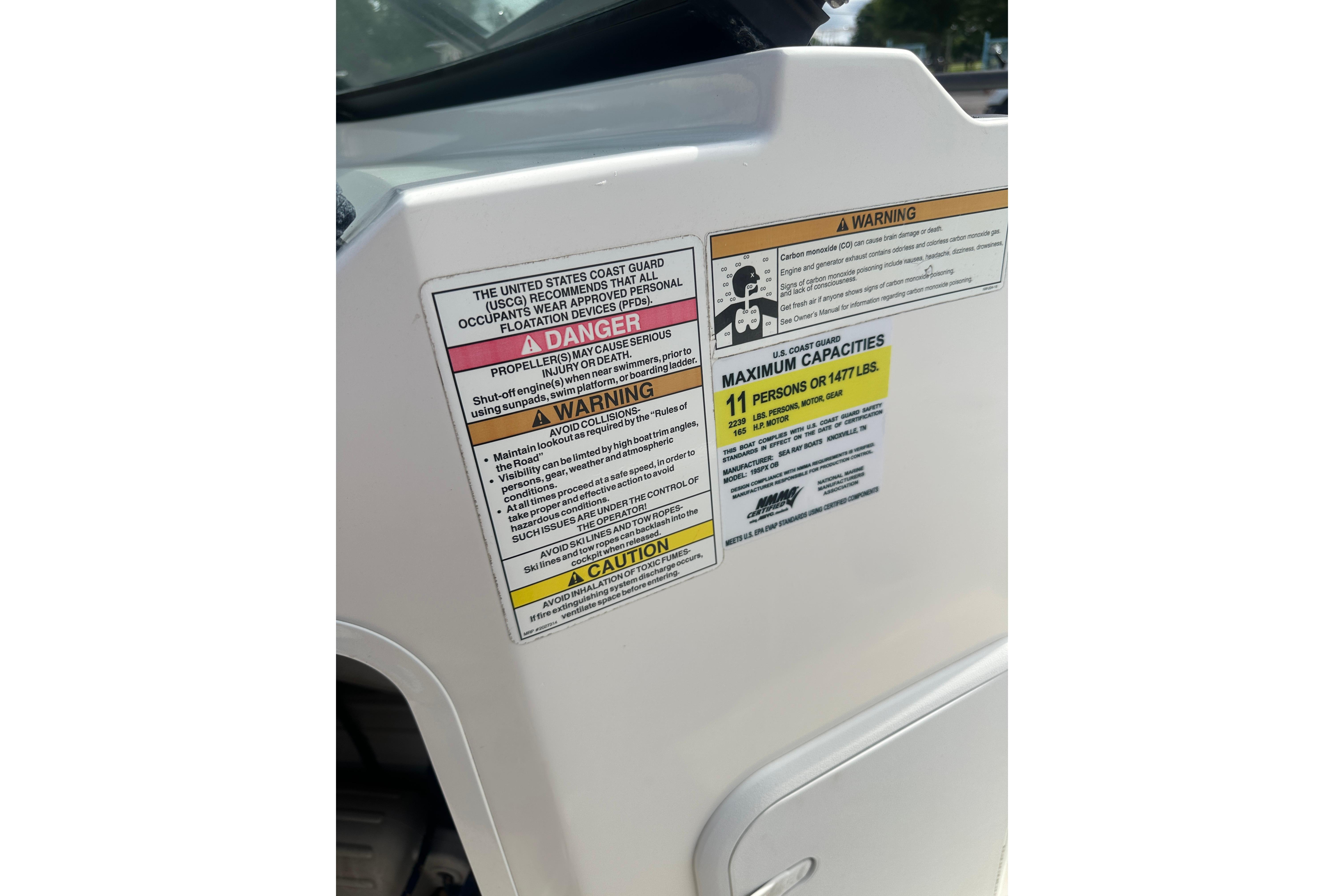 2017 Sea Ray SPX 190 Outboard safety and capacity warning labels.