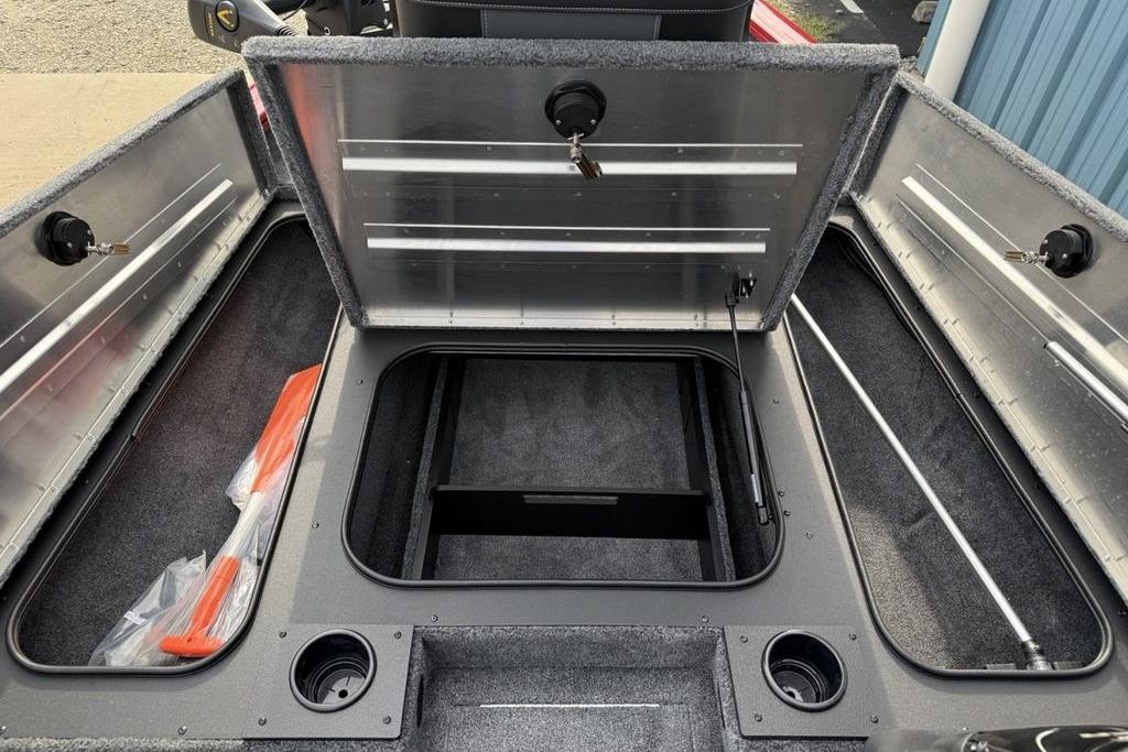 2026 Tracker Pro Team 175 boat storage compartments open, revealing spacious interior.