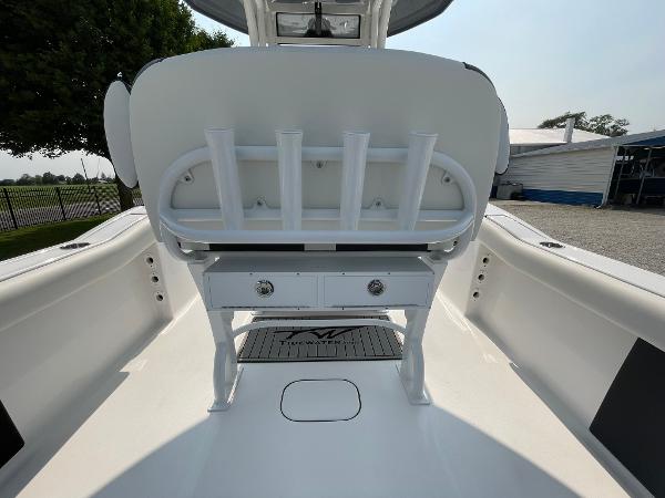 2025 Tidewater 232 CC Adventure boat interior with rod holders and storage drawers.