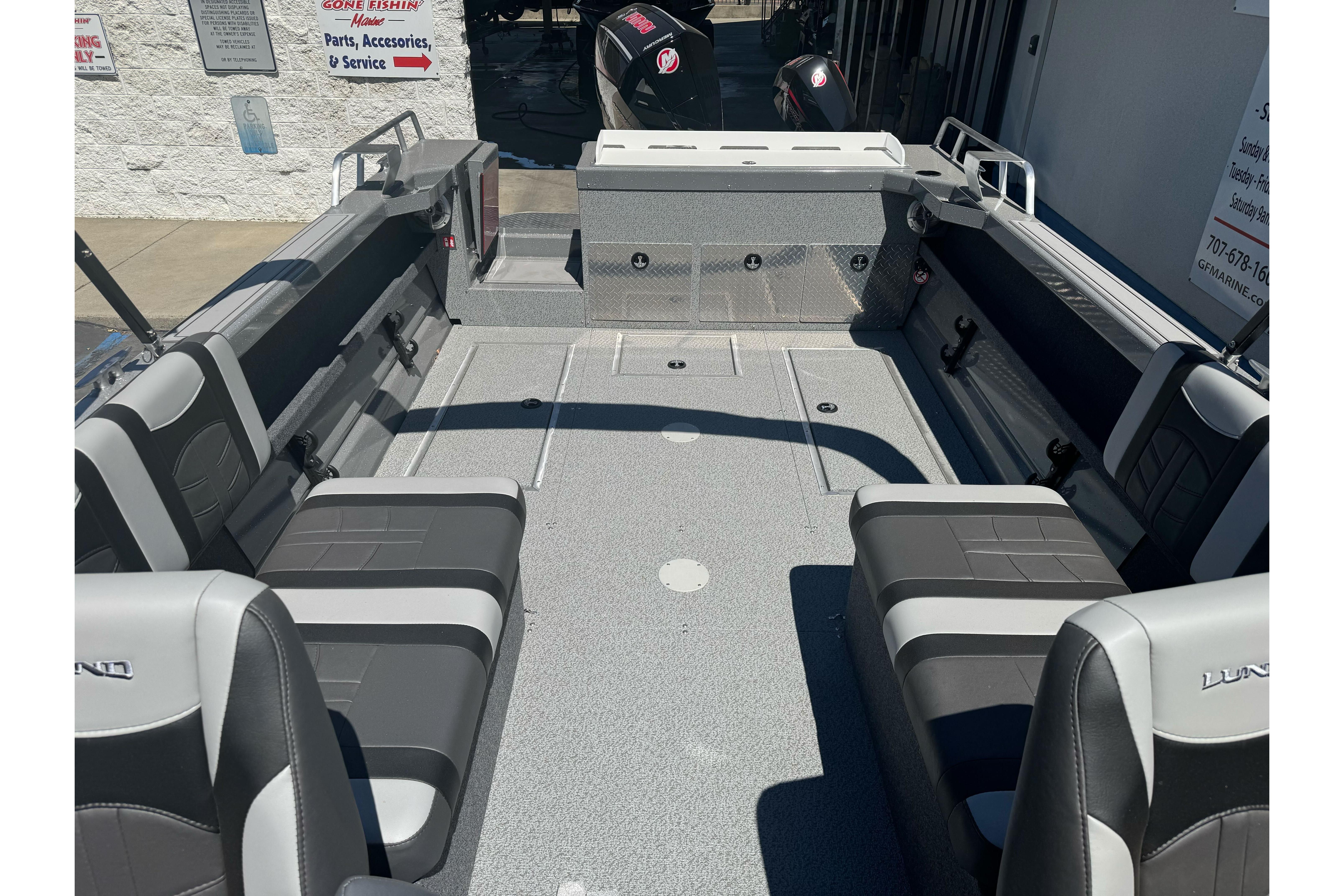 2026 Lund 210 Heavy Gauge boat interior with gray seating and spacious layout.