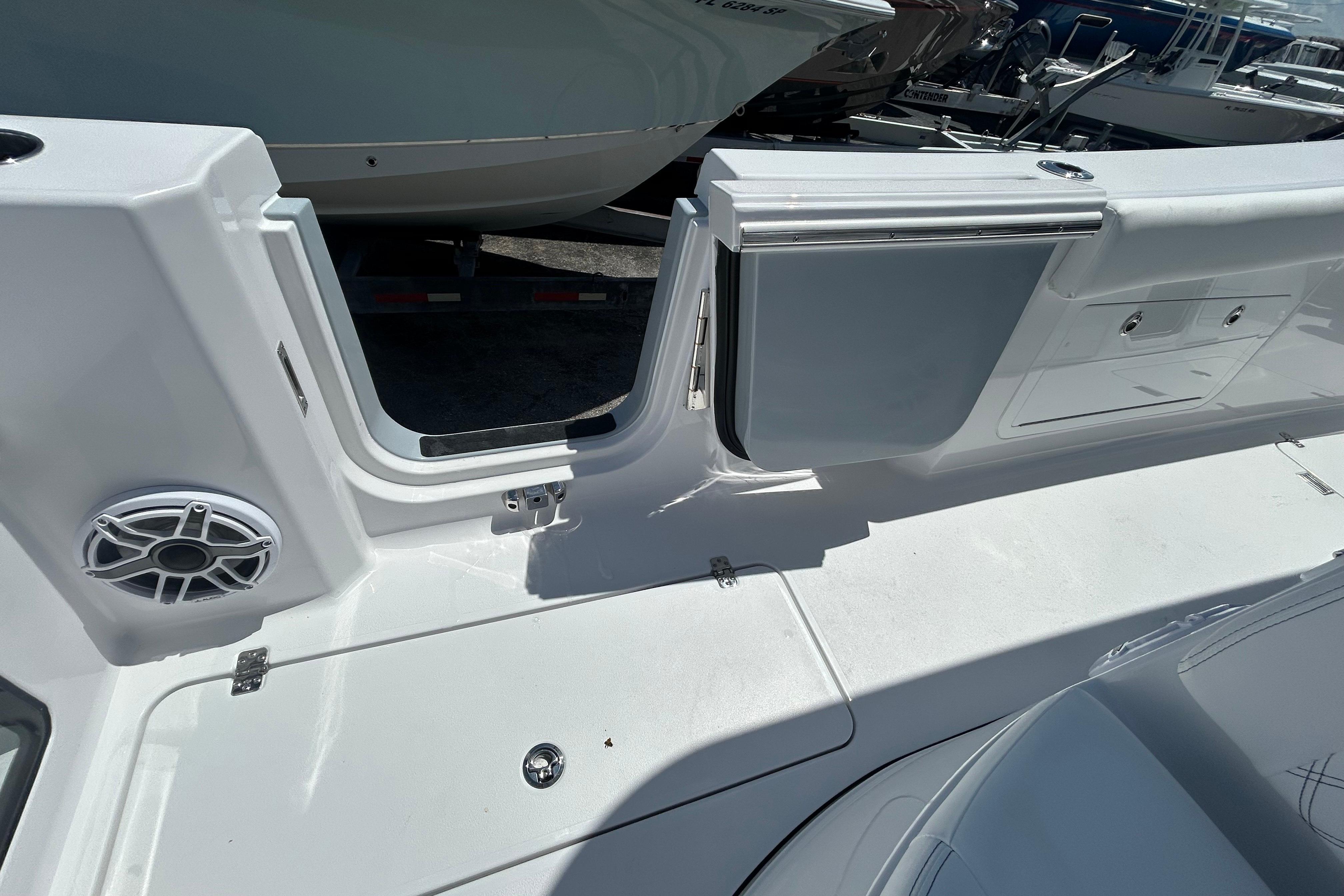 2026 Sportsman Heritage 321 Center Console boat interior with open side door and speaker.