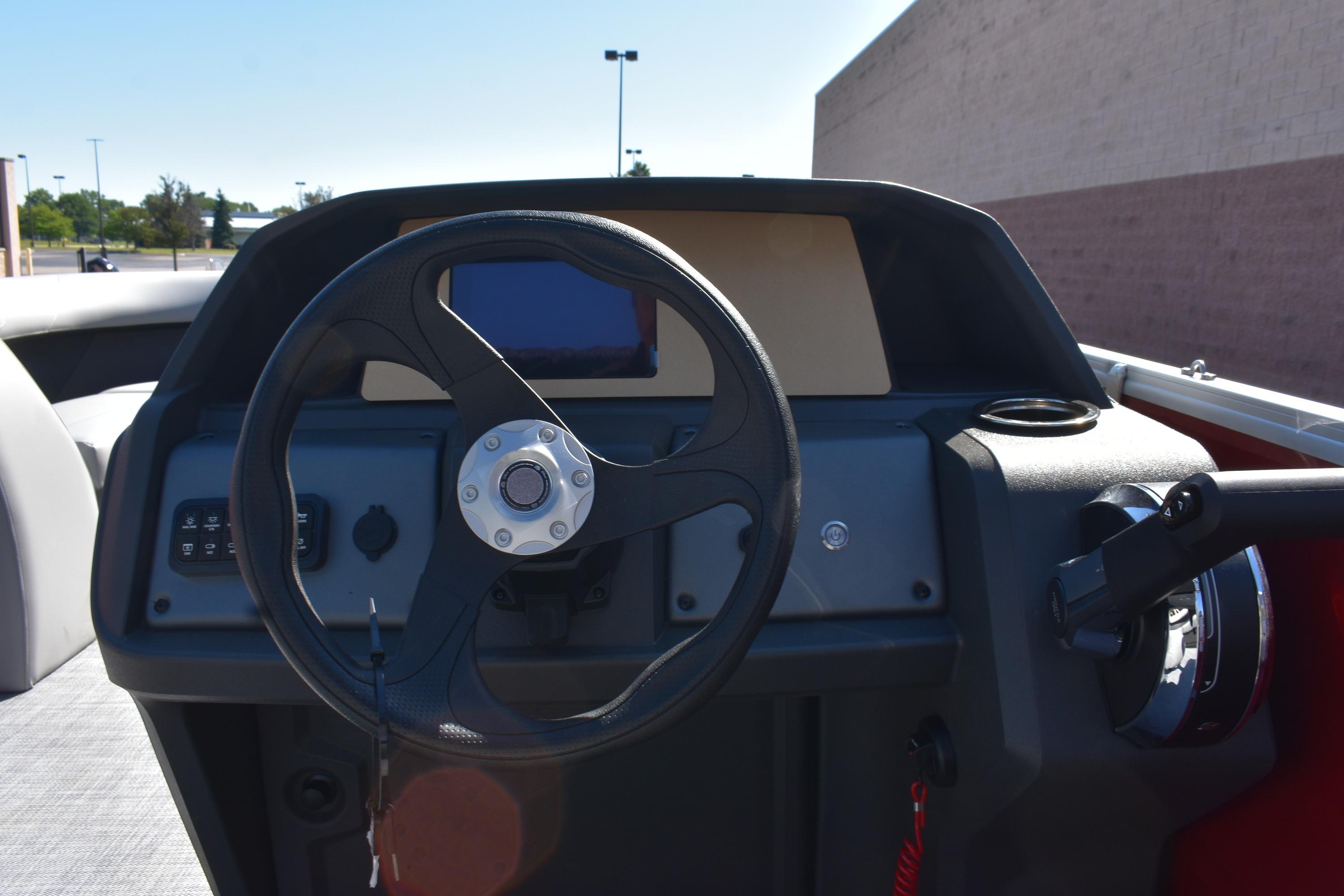 2026 Sun Tracker Party Barge 18 DLX steering console with modern controls and display.