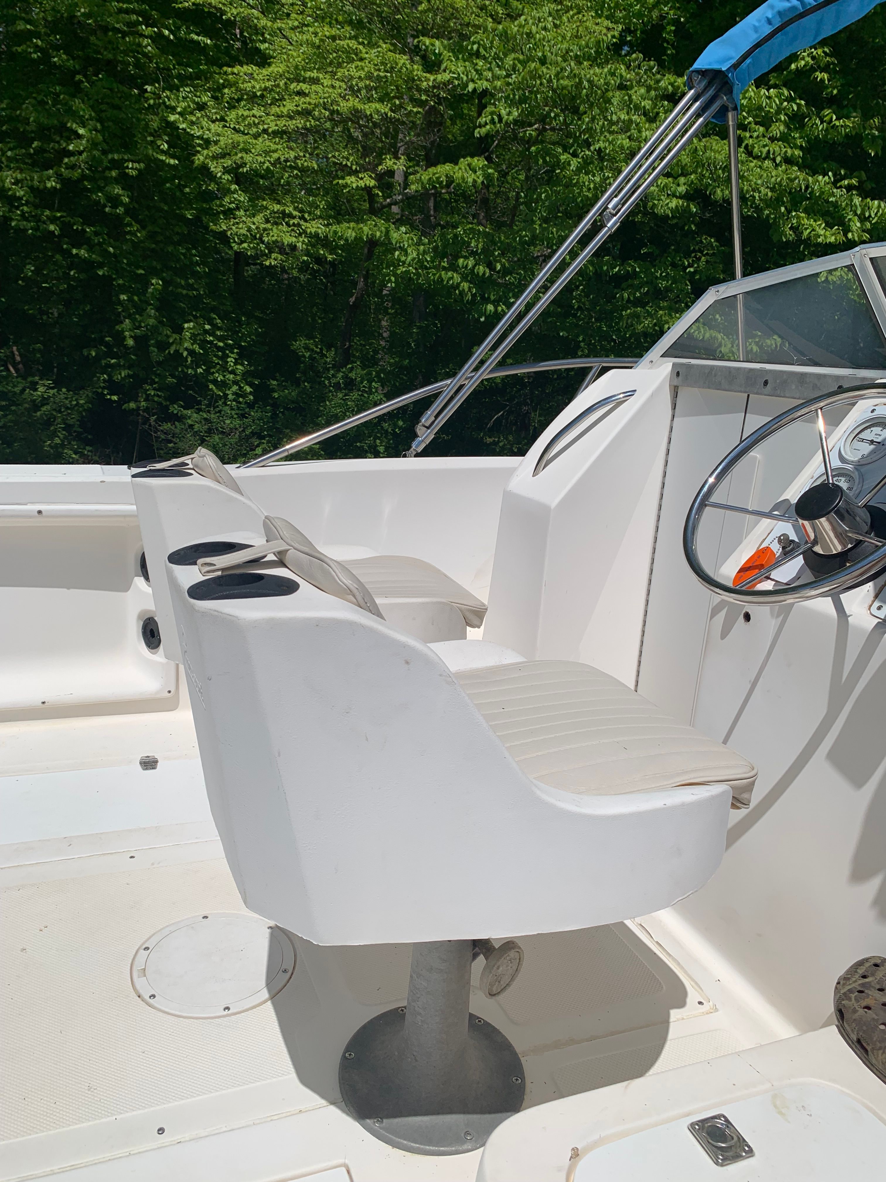 Interior of a 1998 Eurosport 221WA boat with white seats.