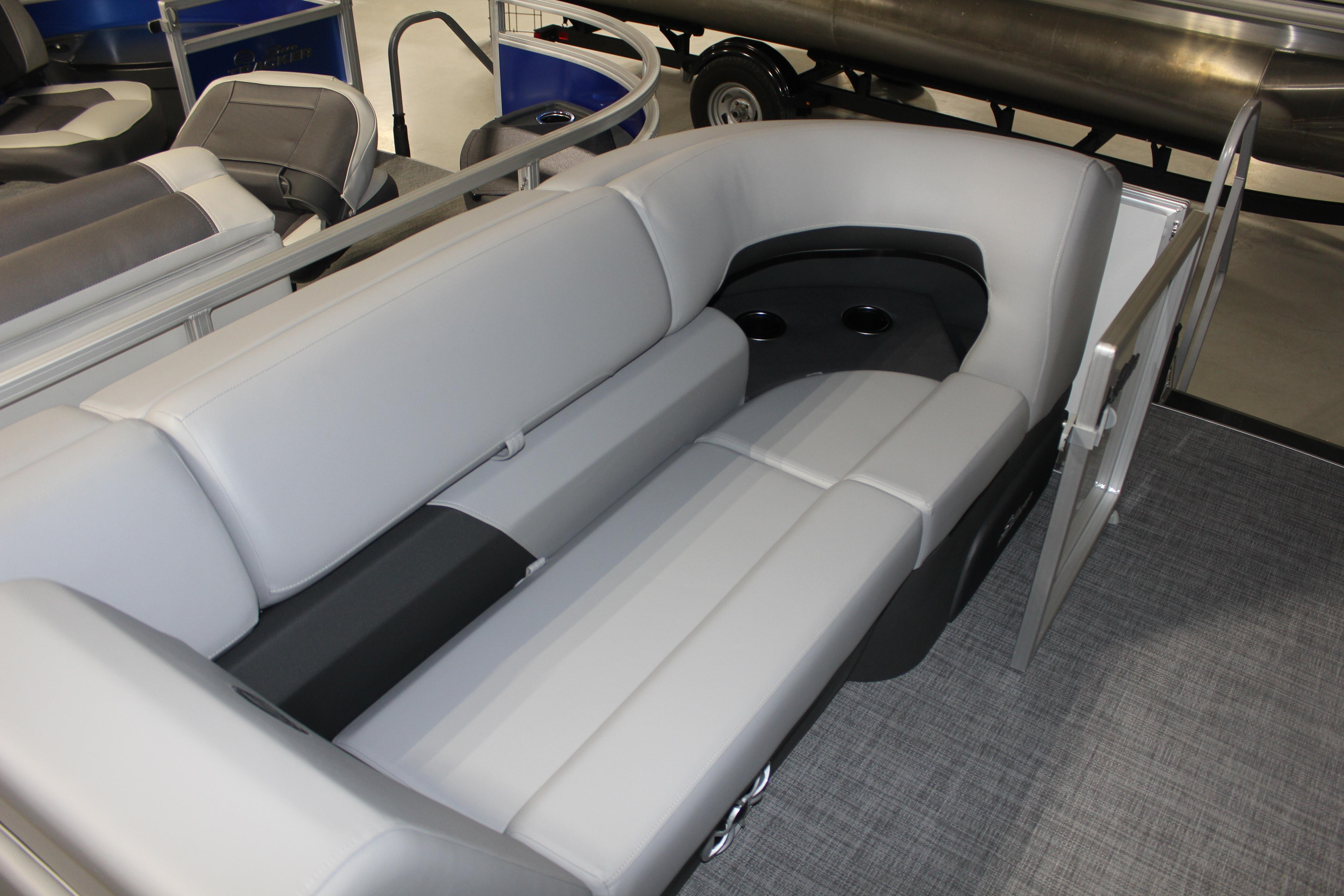 2026 Sun Tracker Party Barge 22 DLX interior seating with cup holders.