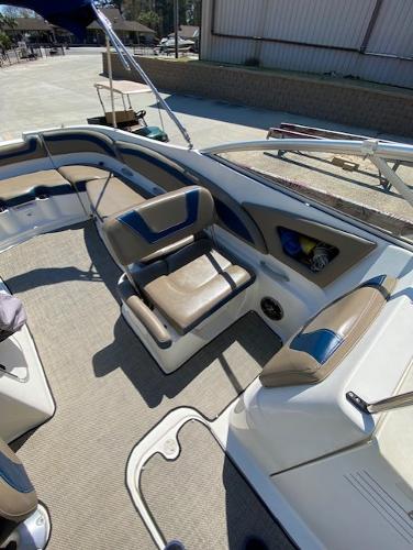 2005 Bayliner 249 SD boat interior with seating and carpeted floor.