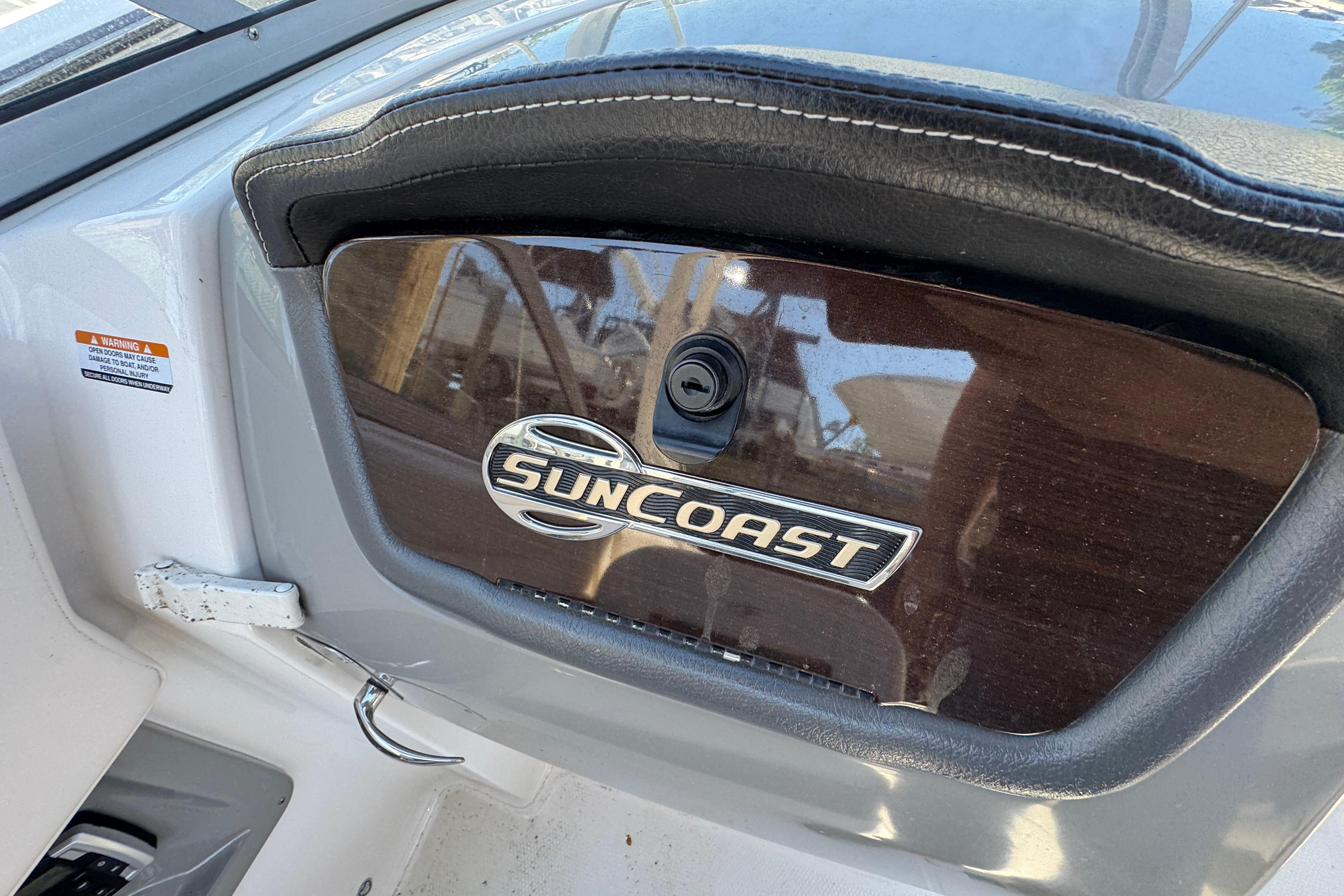 2018 Chaparral 250 Suncoast dashboard with Suncoast emblem and sleek design.