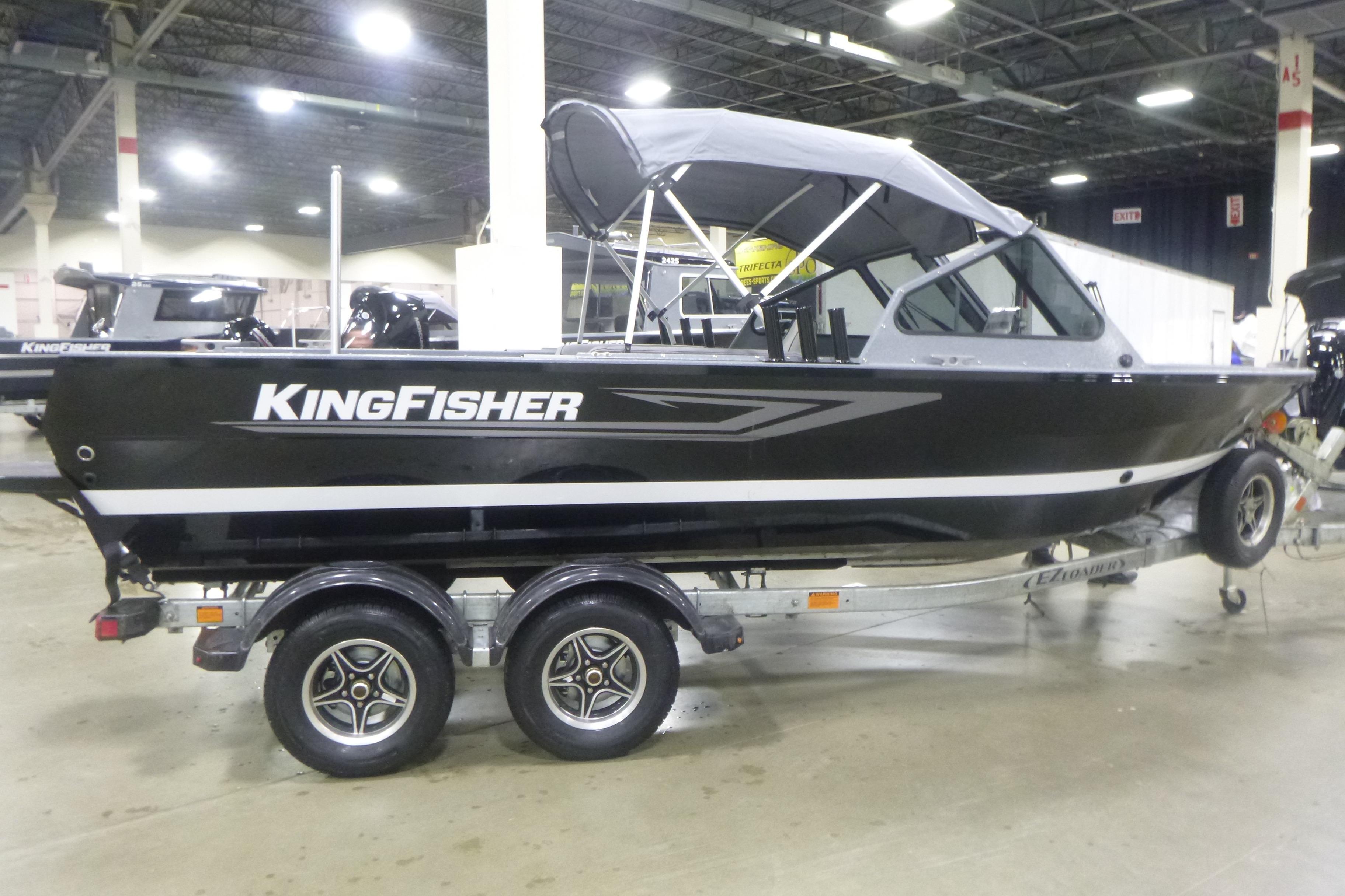 2026 KingFisher 2025 Falcon boat on trailer in indoor showroom.