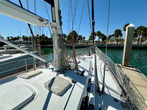 Concordia 52 sailboat docked, 1989 model, sunny marina, palm trees in background.