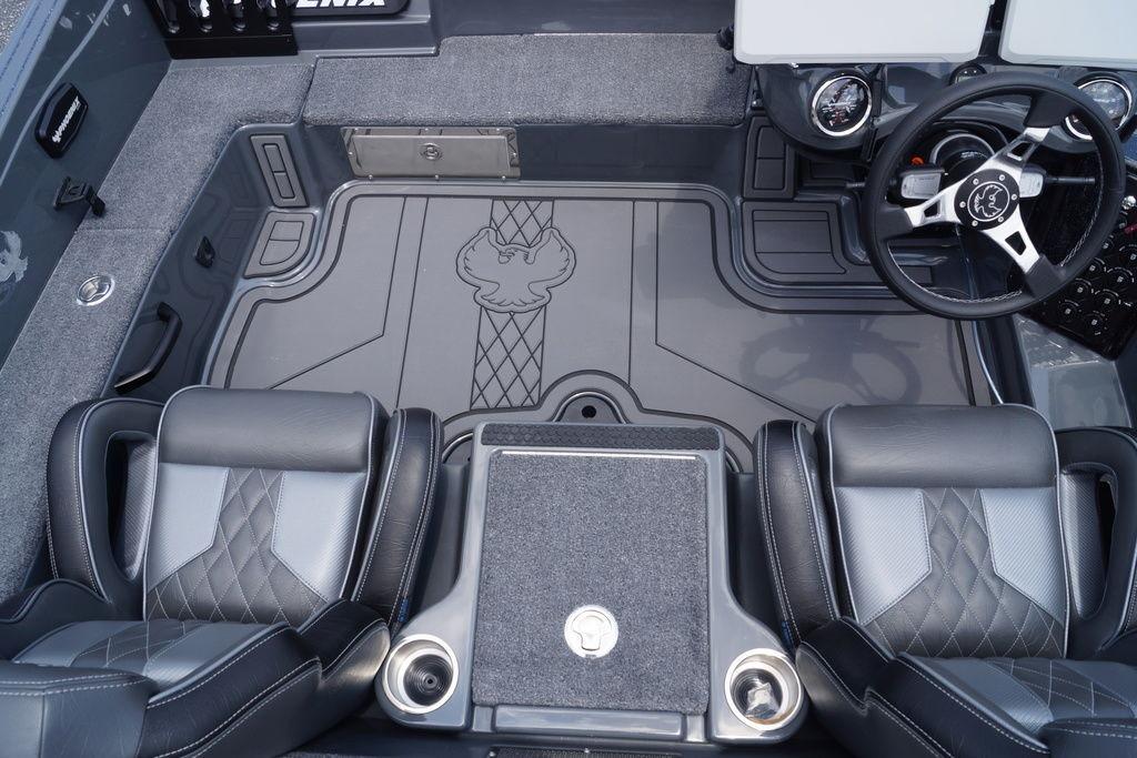 Interior of a 2027 Phoenix 921 Elite X II boat, featuring sleek seating and modern controls.