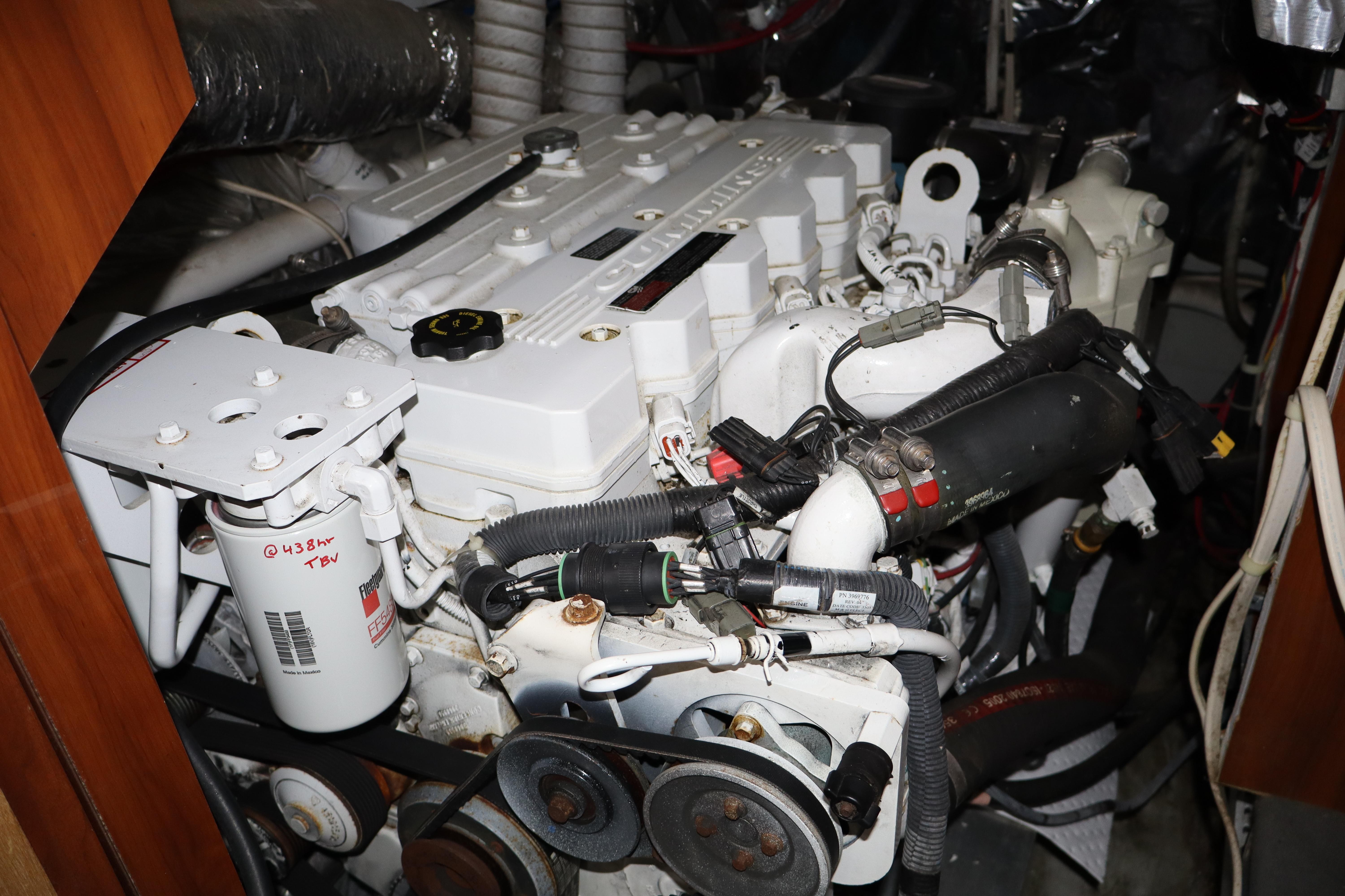 Engine room of 2006 Bluewater Yachts 5200, showcasing detailed mechanical components and systems.