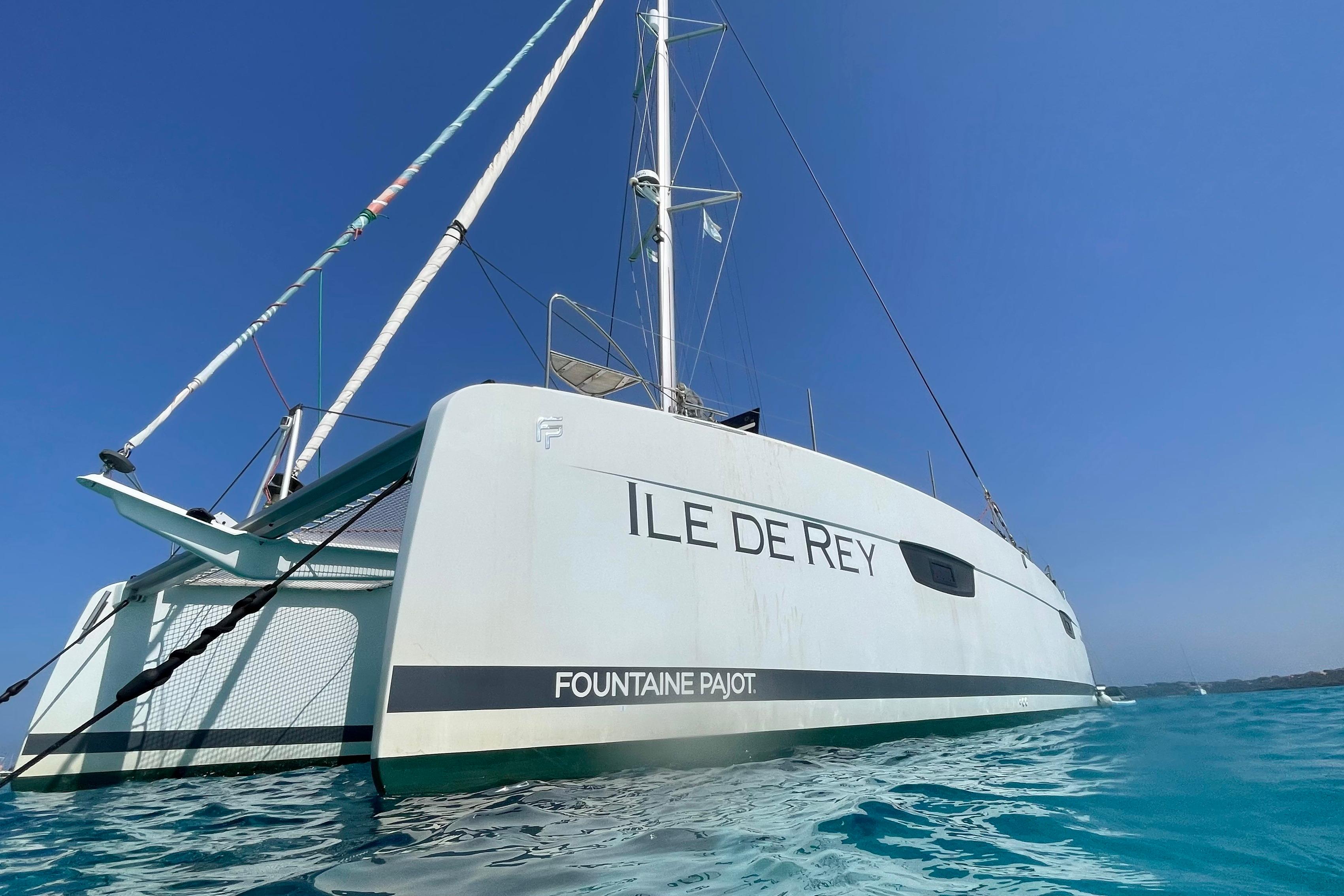2020 Fountaine Pajot Saona 47 catamaran sailing on clear blue waters.