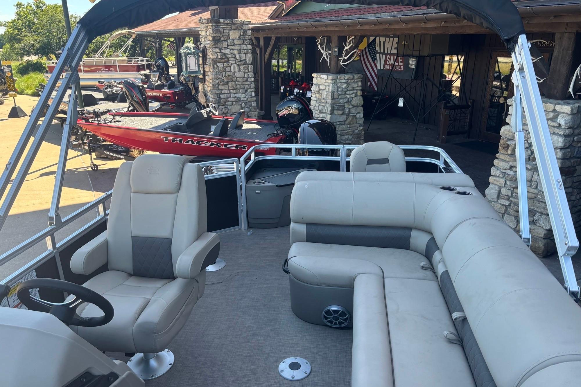 2025 Sun Tracker SportFish 20 DLX pontoon boat with spacious seating and modern design.