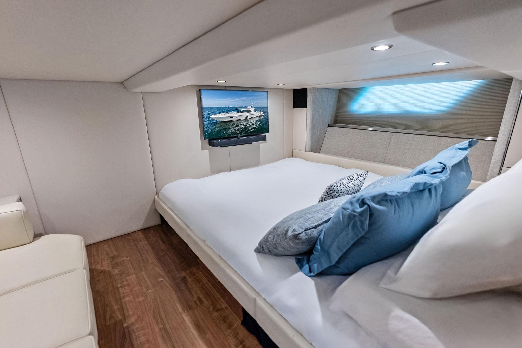 Luxurious cabin interior of 2025 Formula 500 Super Sport Crossover with bed and TV.