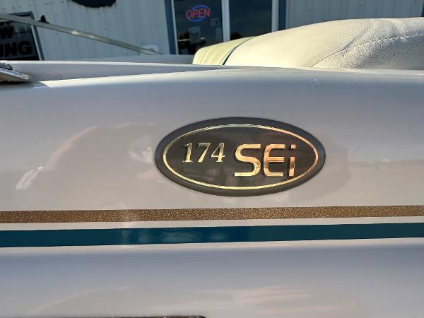 1995 Larson 174 SEI boat emblem with gold and teal accents.