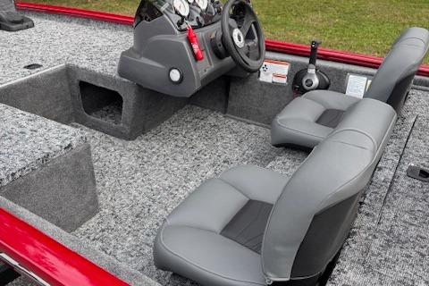 2026 Tracker Pro 170 boat interior with gray seats and steering console.