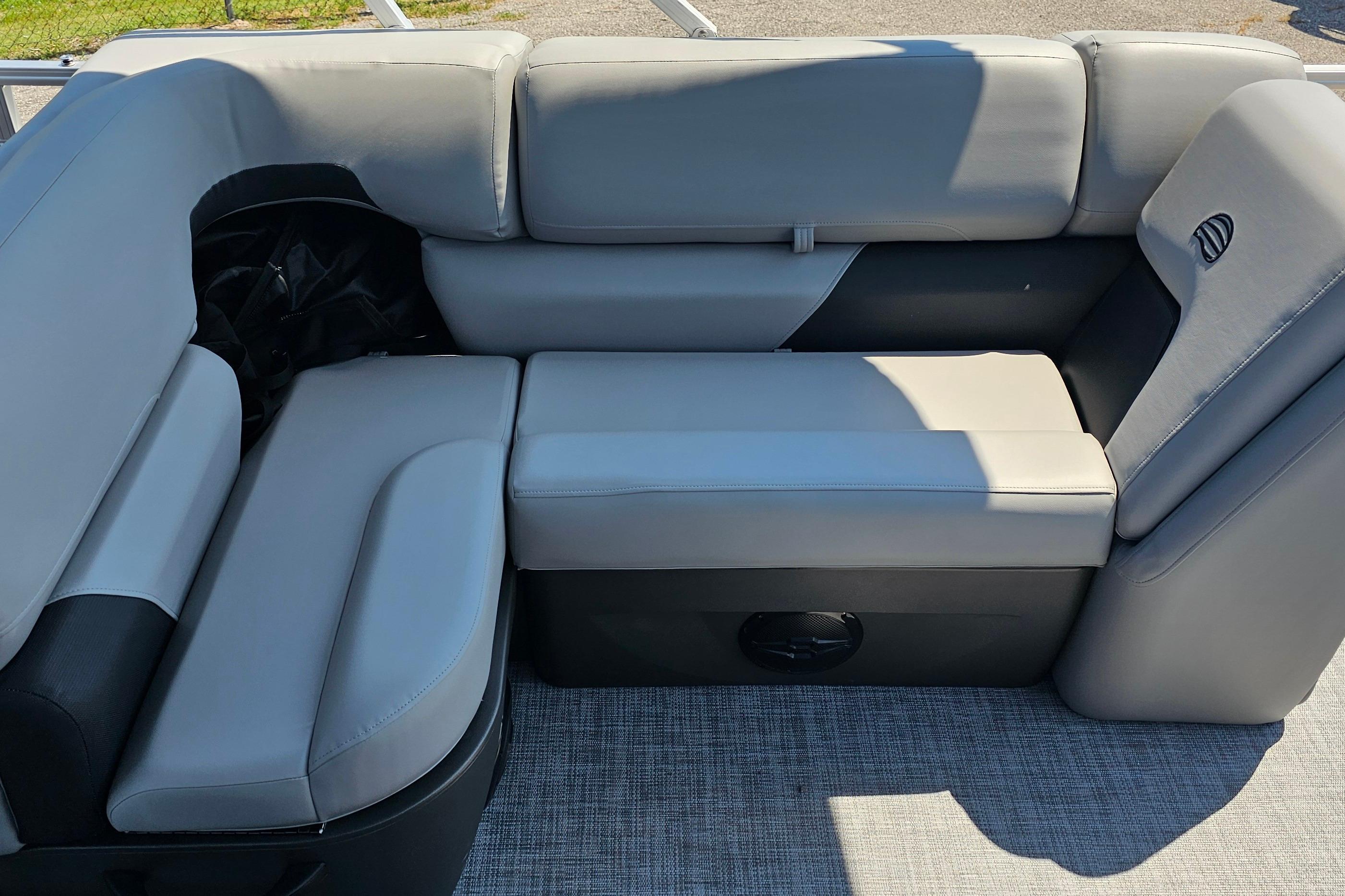 2026 Sun Tracker SportFish 20 DLX boat interior with gray cushioned seating.