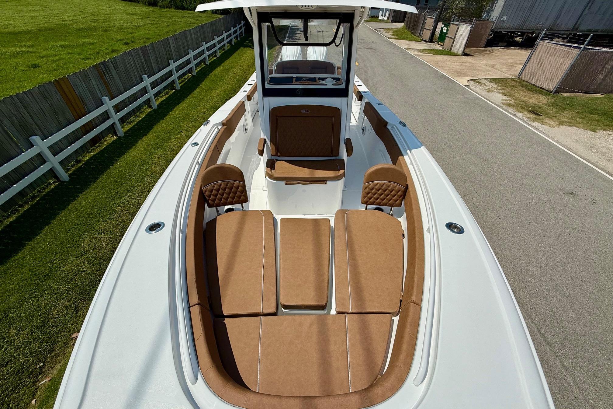2026 Sea Hunt Ultra 305 SE boat with tan seating and spacious deck.