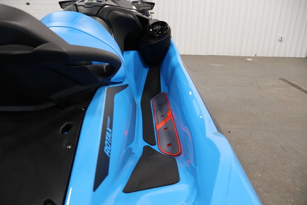 2026 Sea-Doo RXT-X 325 jet ski, blue interior, showcasing sleek design and Rotax engine branding.