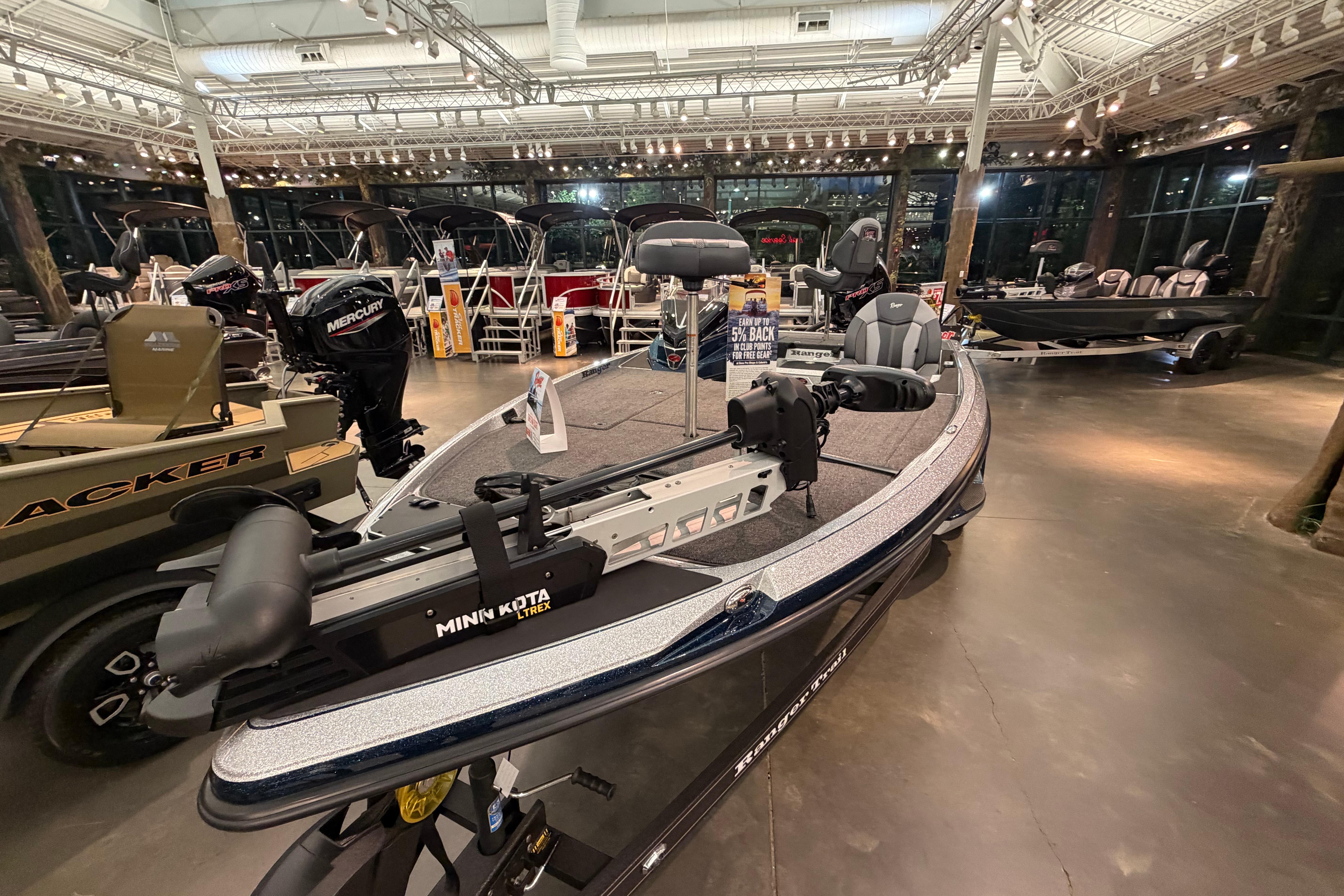 2026 Ranger Z519R fishing boat displayed in a showroom with modern features.