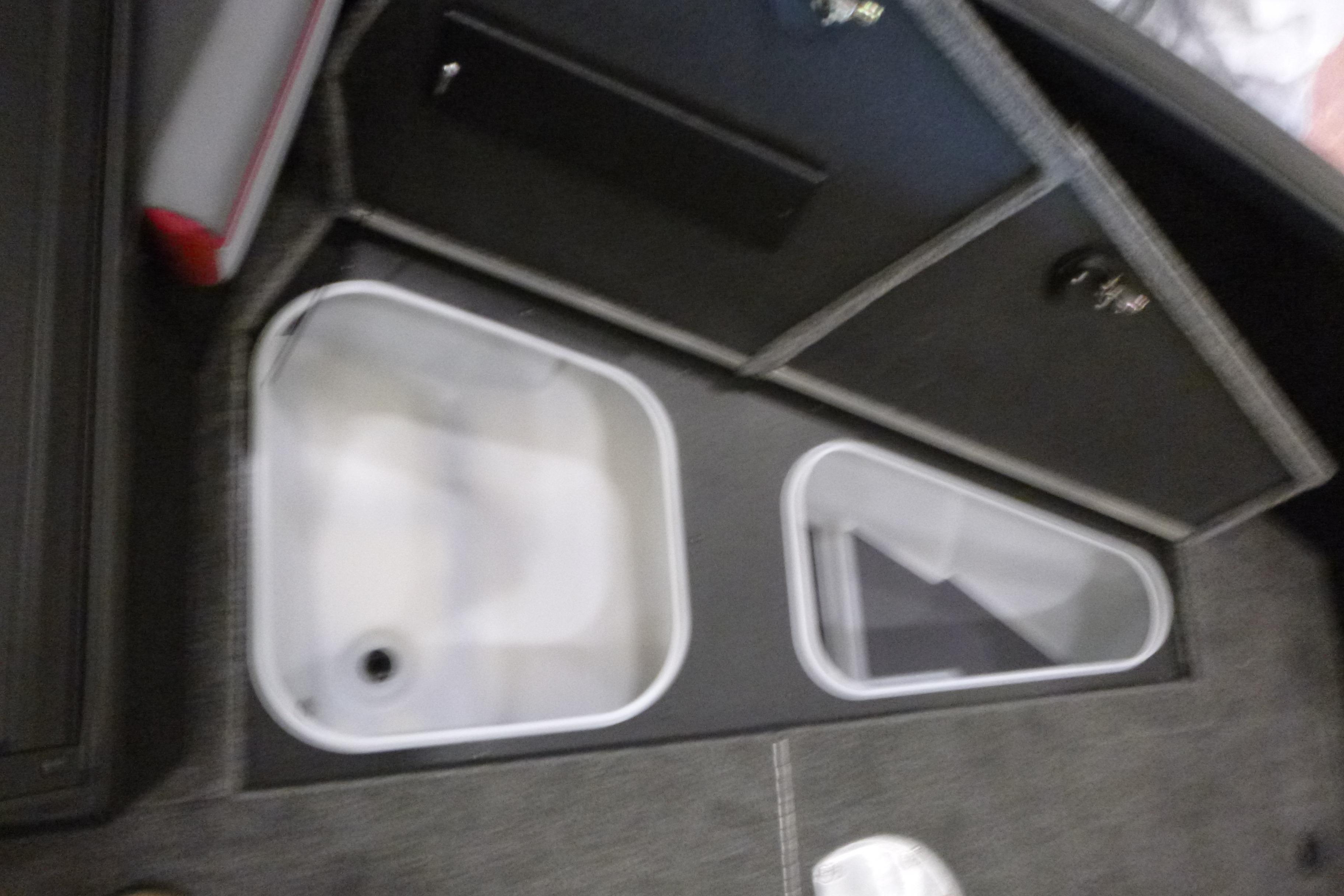 2025 Alumacraft Trophy 185X Sport boat storage compartments, featuring dual bins and secure lids.