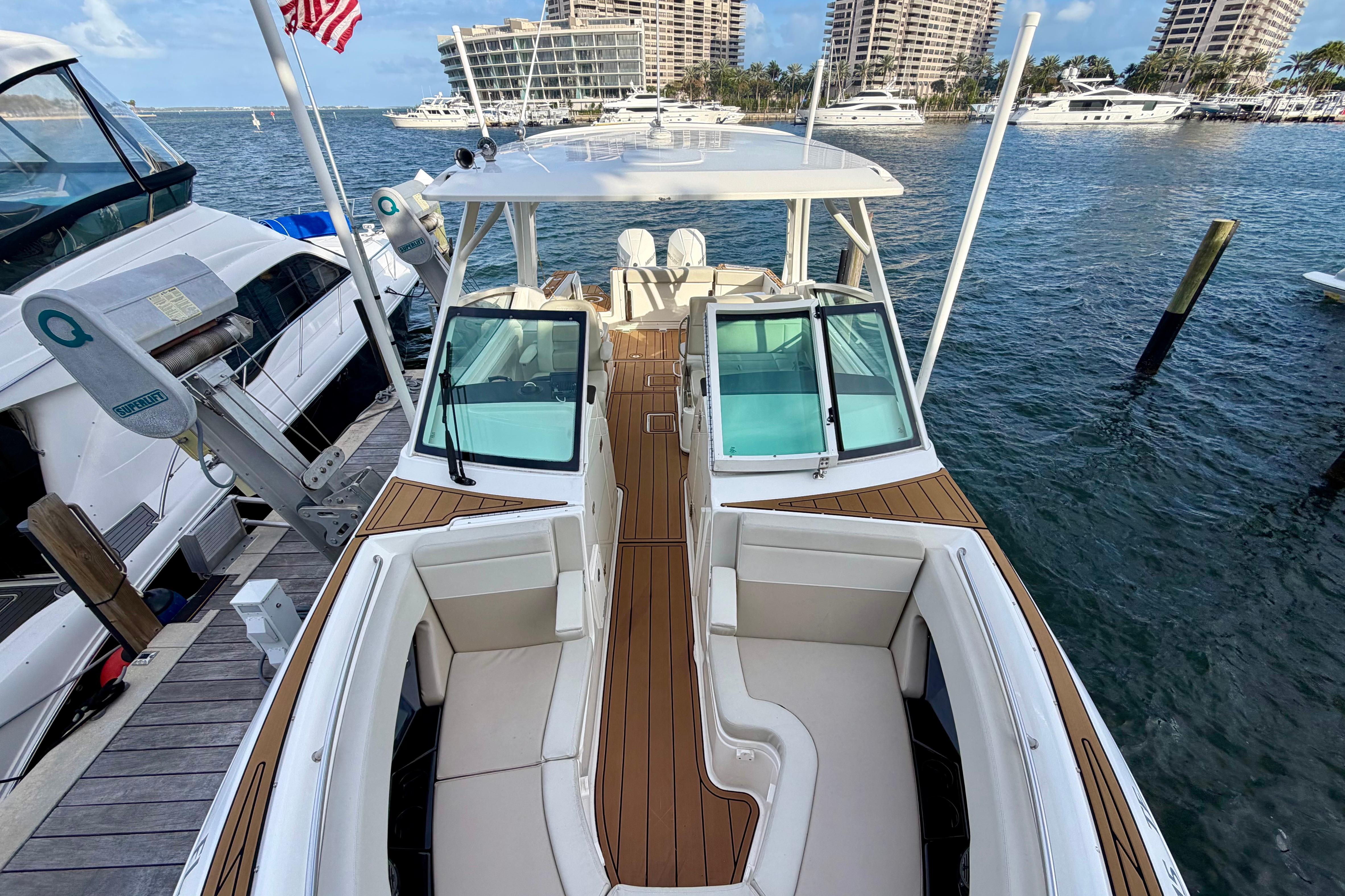 2022 Boston Whaler 280 Vantage docked, showcasing spacious seating and sleek design.