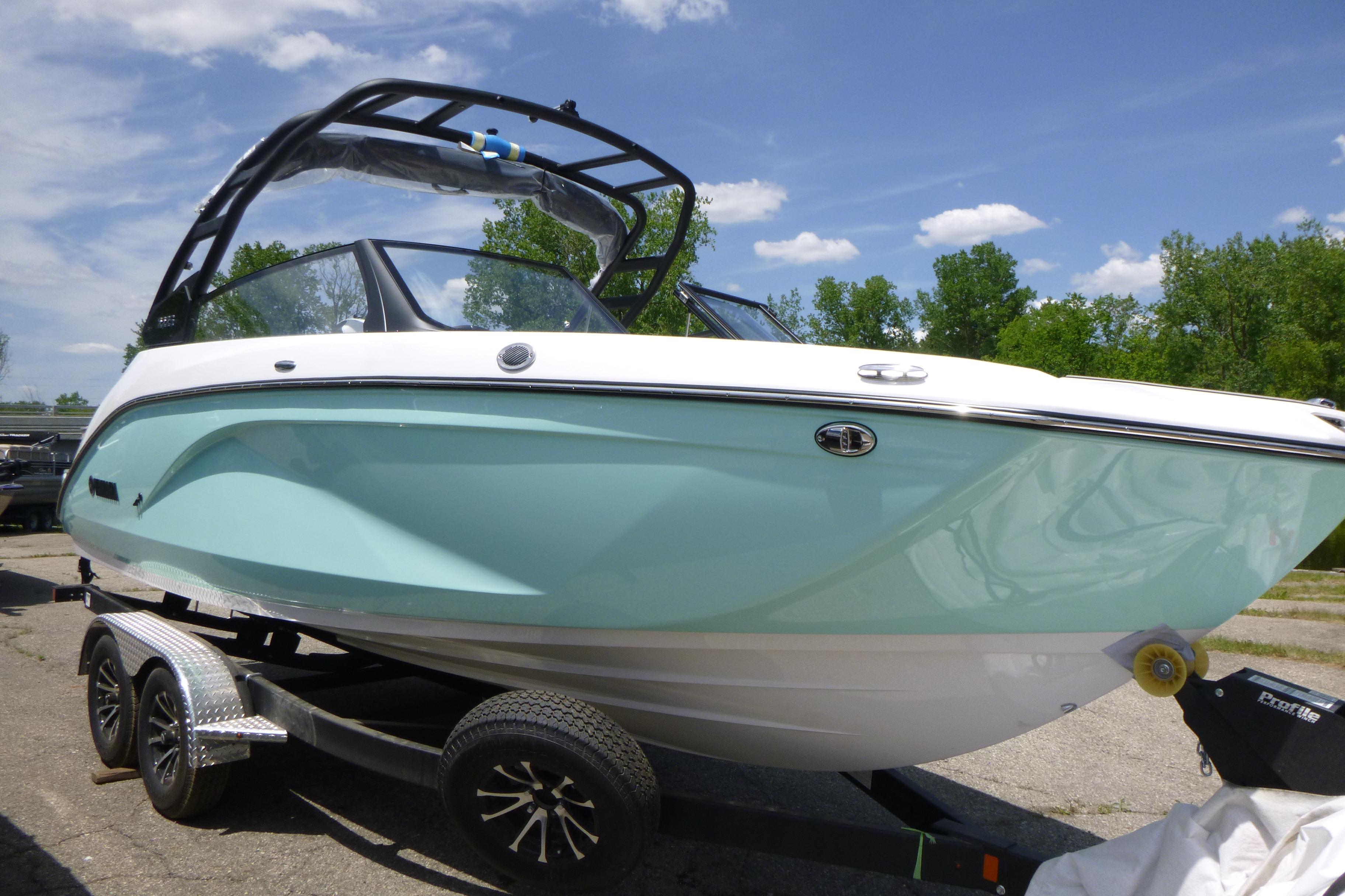 2026 Yamaha Boats 222S on trailer, sleek design, light blue hull, sunny day.