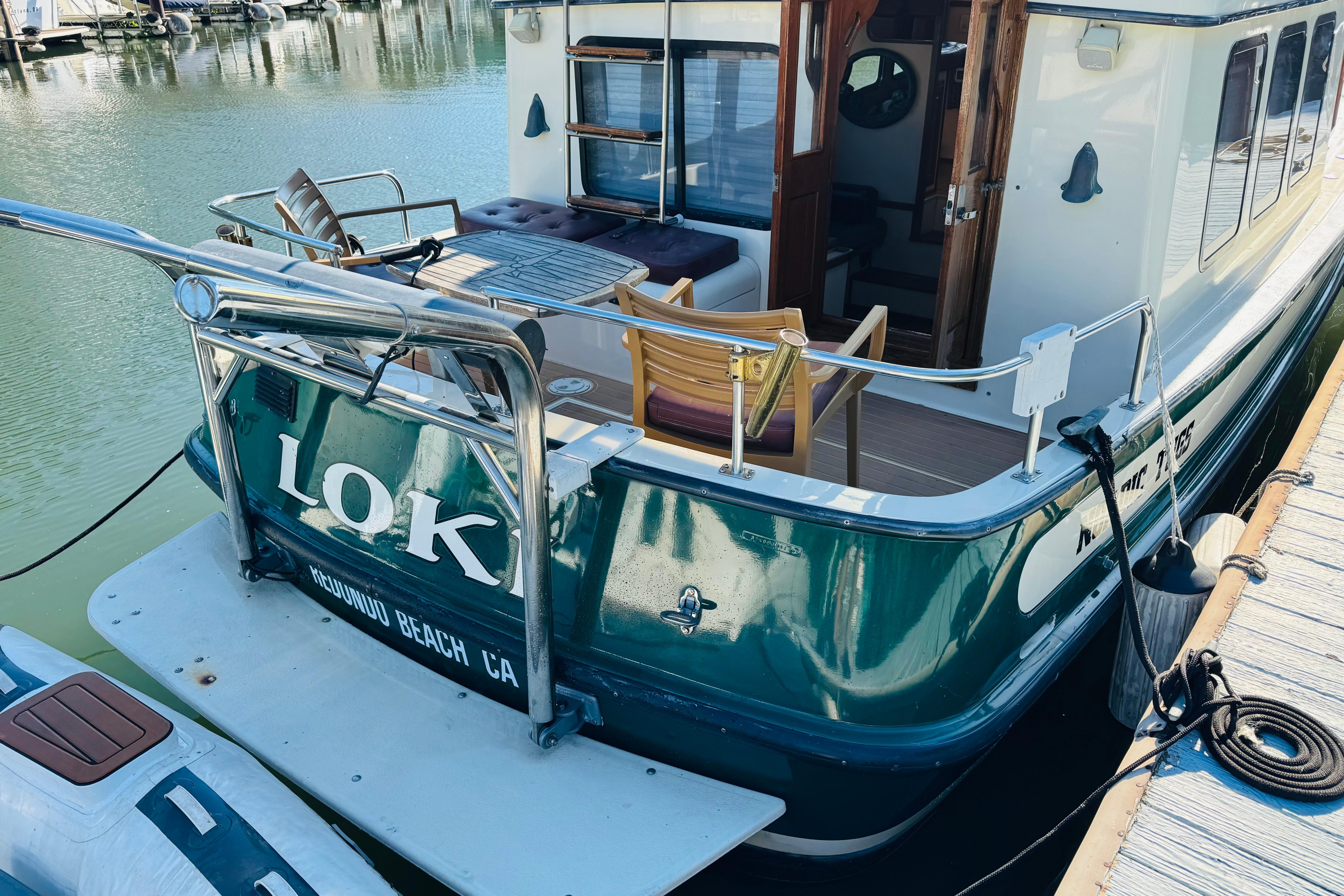 Nordic Tug 32, 1996 model, docked with outdoor seating, Redondo Beach, CA.