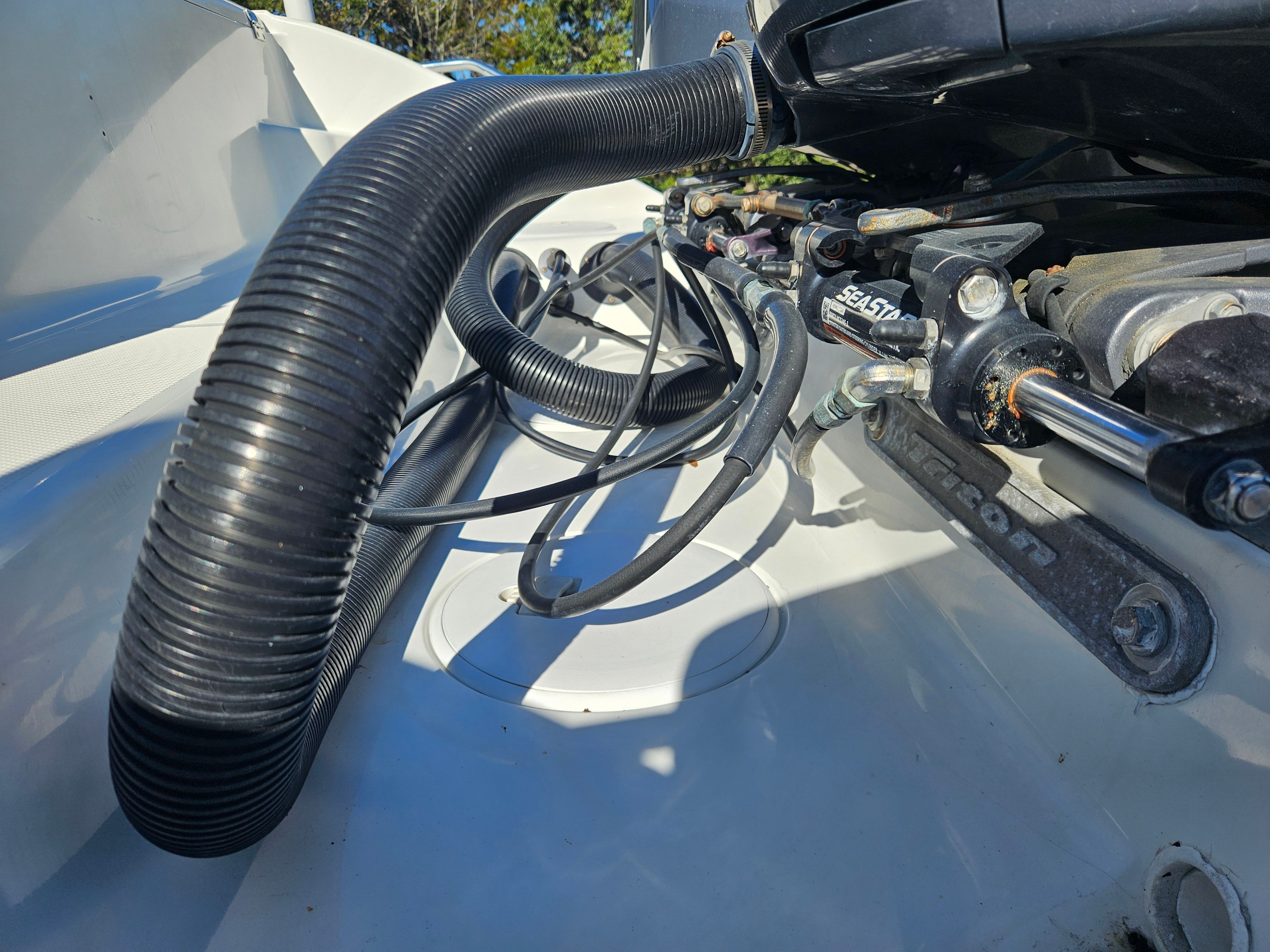 Close-up of a 2004 Triton 2690 CC boat engine compartment.