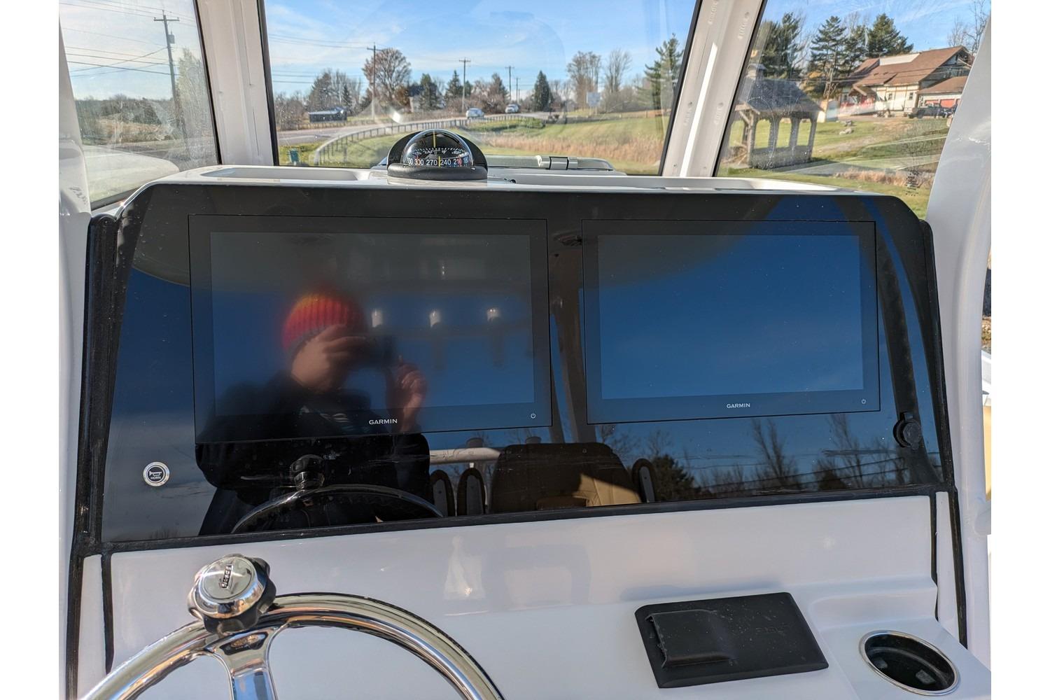 2025 Sportsman Open 282 Center Console dashboard with dual Garmin displays and steering wheel.