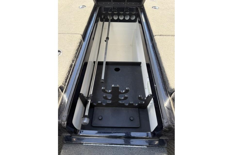 2016 Triton 216 Fishunter rod storage compartment with organized holders.